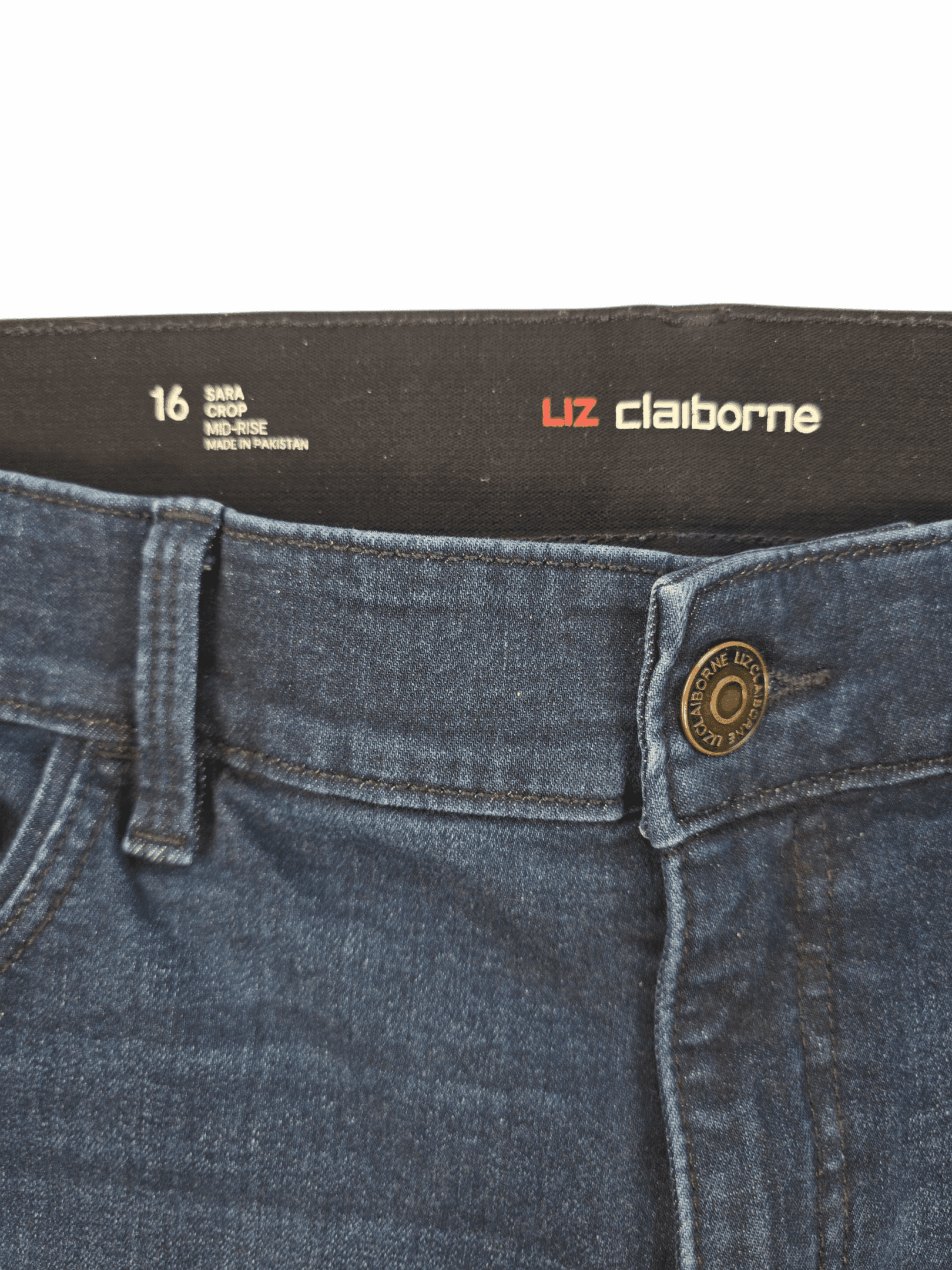 Close-up of Liz Claiborne Sara brand and size 16 tag on blue cropped mid-rise jeans
