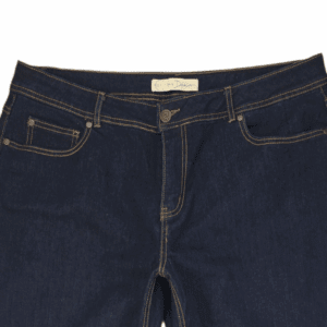 Close-up of EST. 1946 denim blue straight-leg jeans showing waistband, button, and front stitching detail.