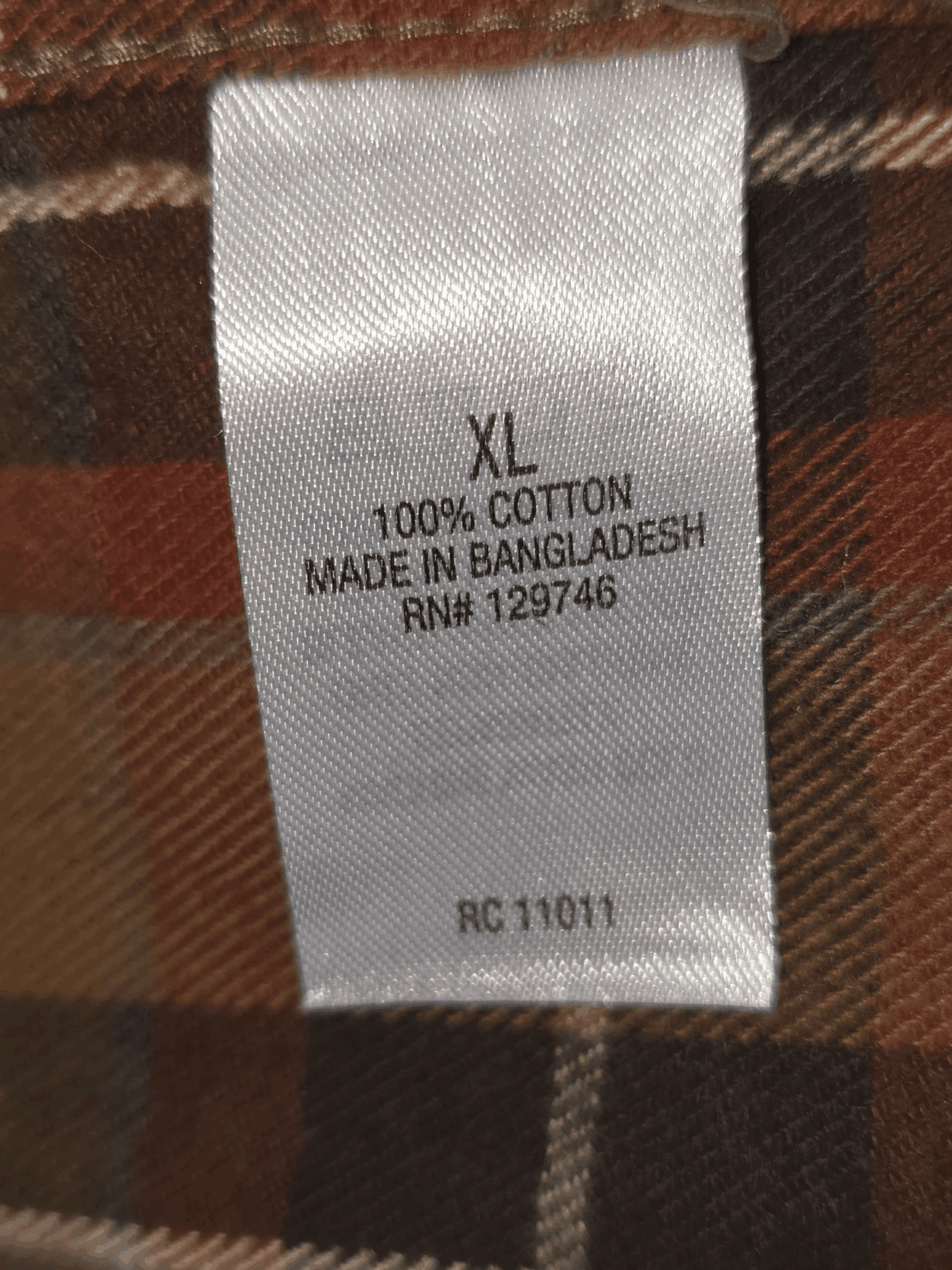 Fabric content tag from Ridgecut Toughwear green plaid cotton flannel shirt men’s size XL