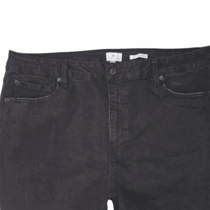 Close-up of True Craft high rise skinny black jeans front showing button closure, zipper, and waistband detail.