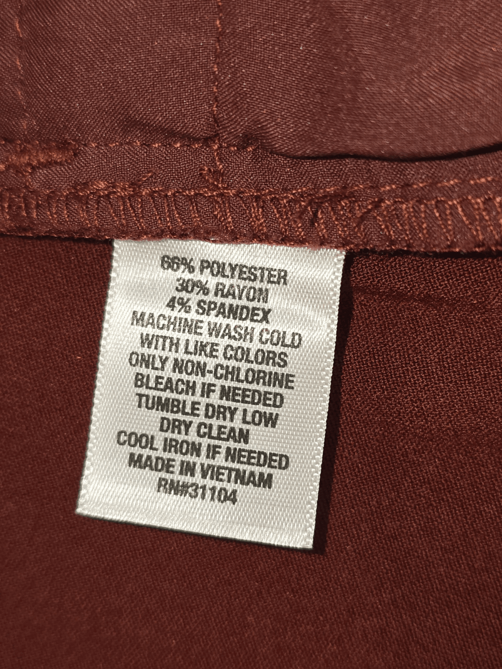 Garment care instruction tag from Saddlebred wine-colored high-neck knit pullover men’s size 2X