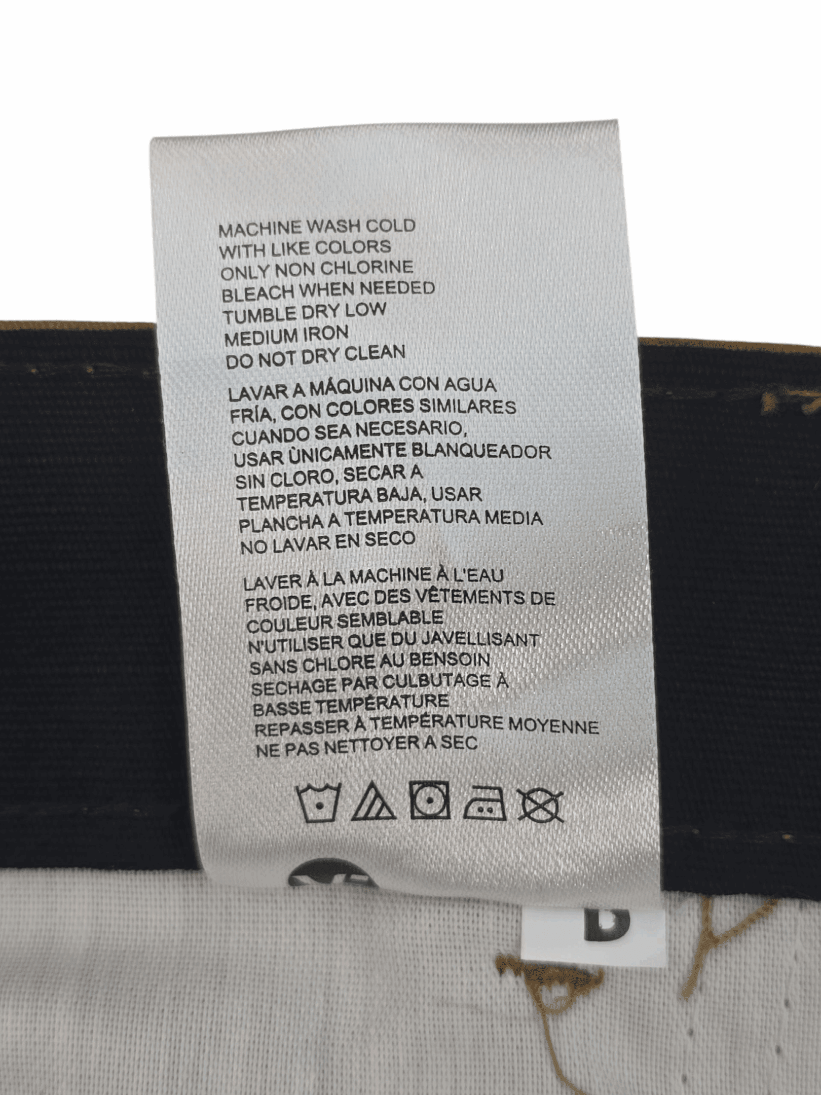 Garment care instruction tag from Dickies brown ripstop cargo shorts men’s big & tall size 44