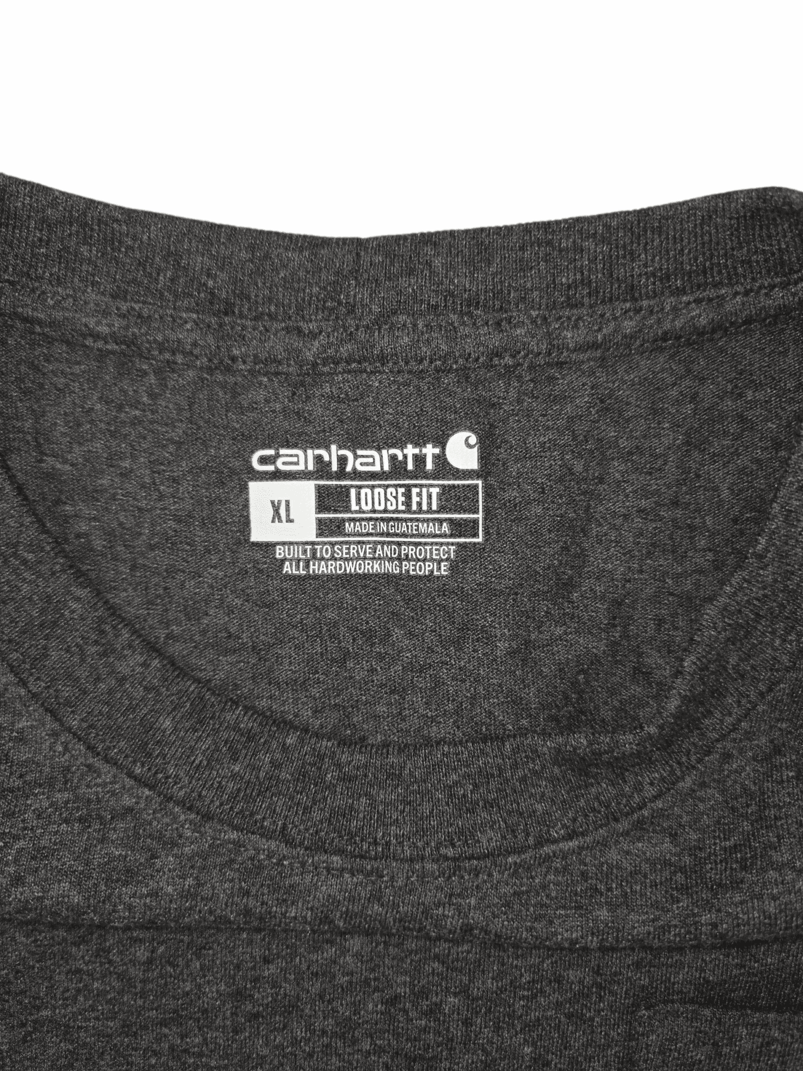 Close-up of a Carhartt XL charcoal gray T-shirt label inside the collar.