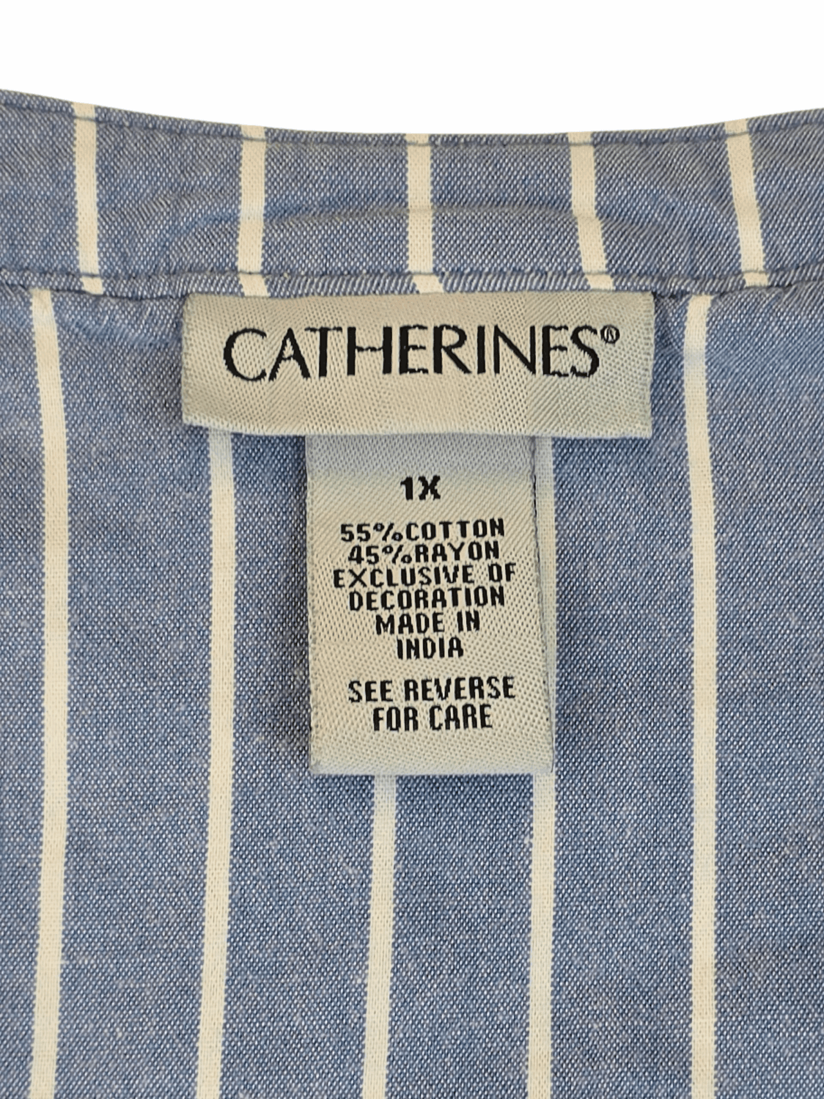 Clothing label from Catherines on a blue and white striped fabric.