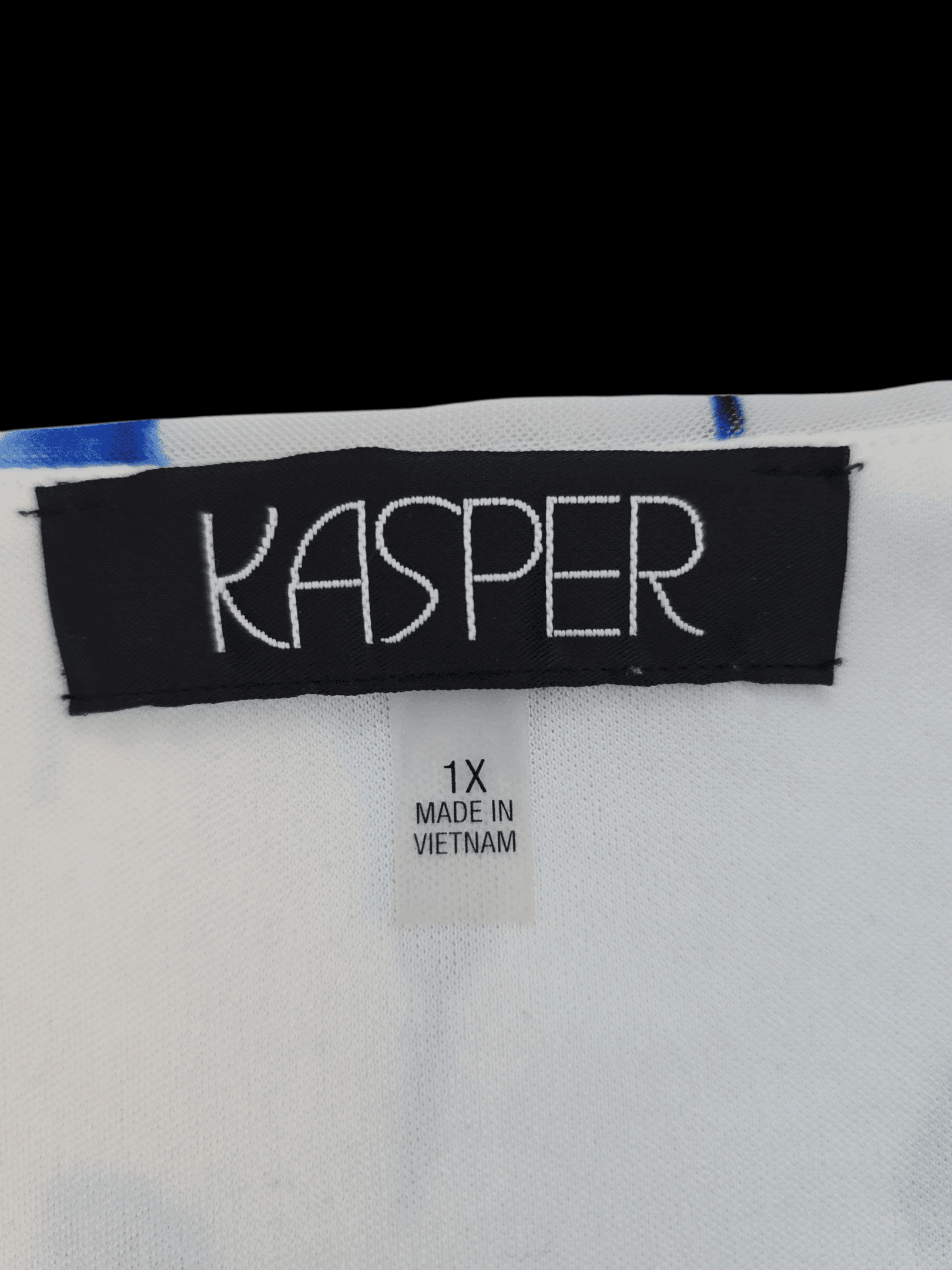 Clothing label showing brand Kasper and size XL from Vietnam.