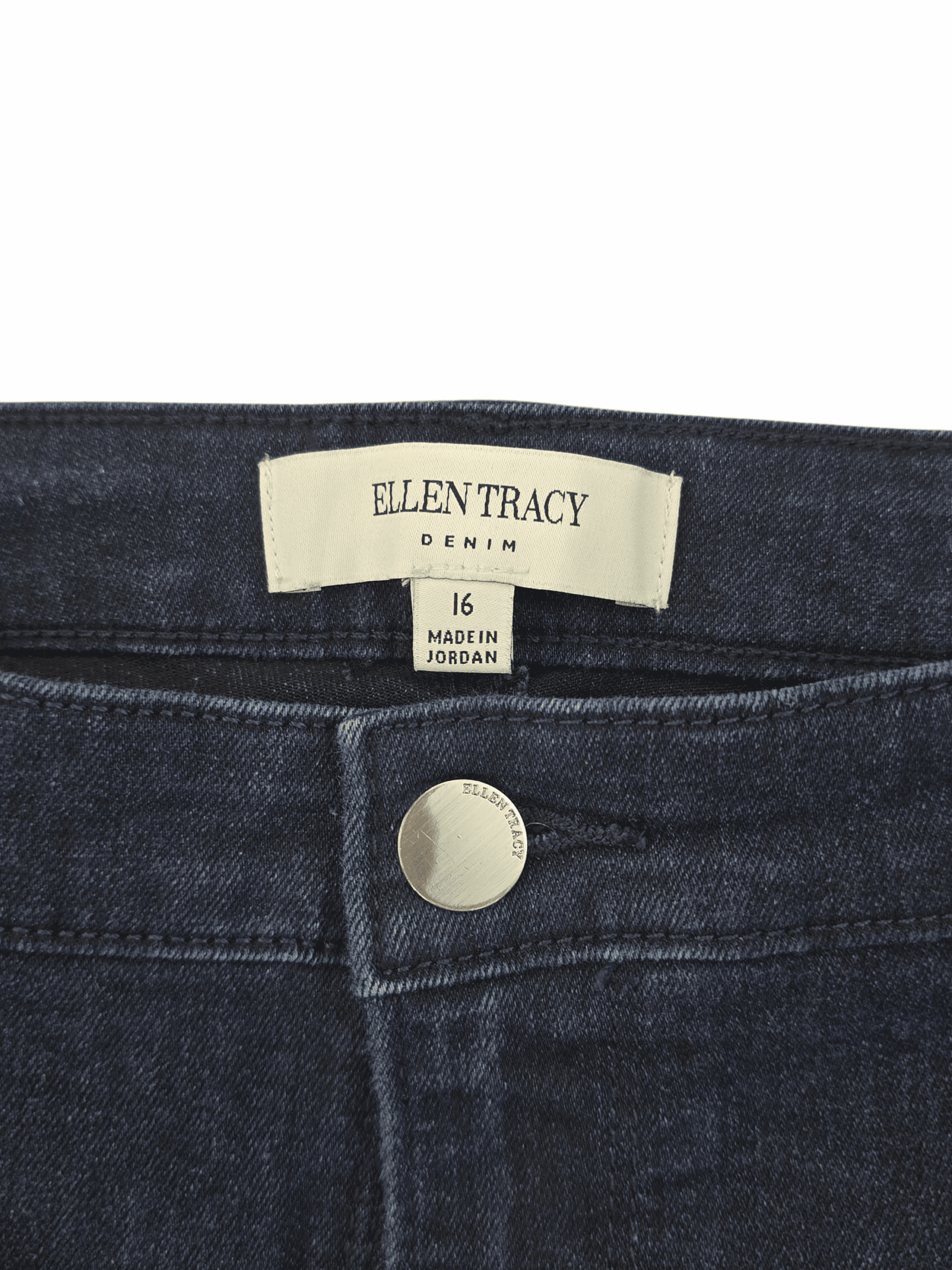Close-up of Ellen Tracy jeans label and button.