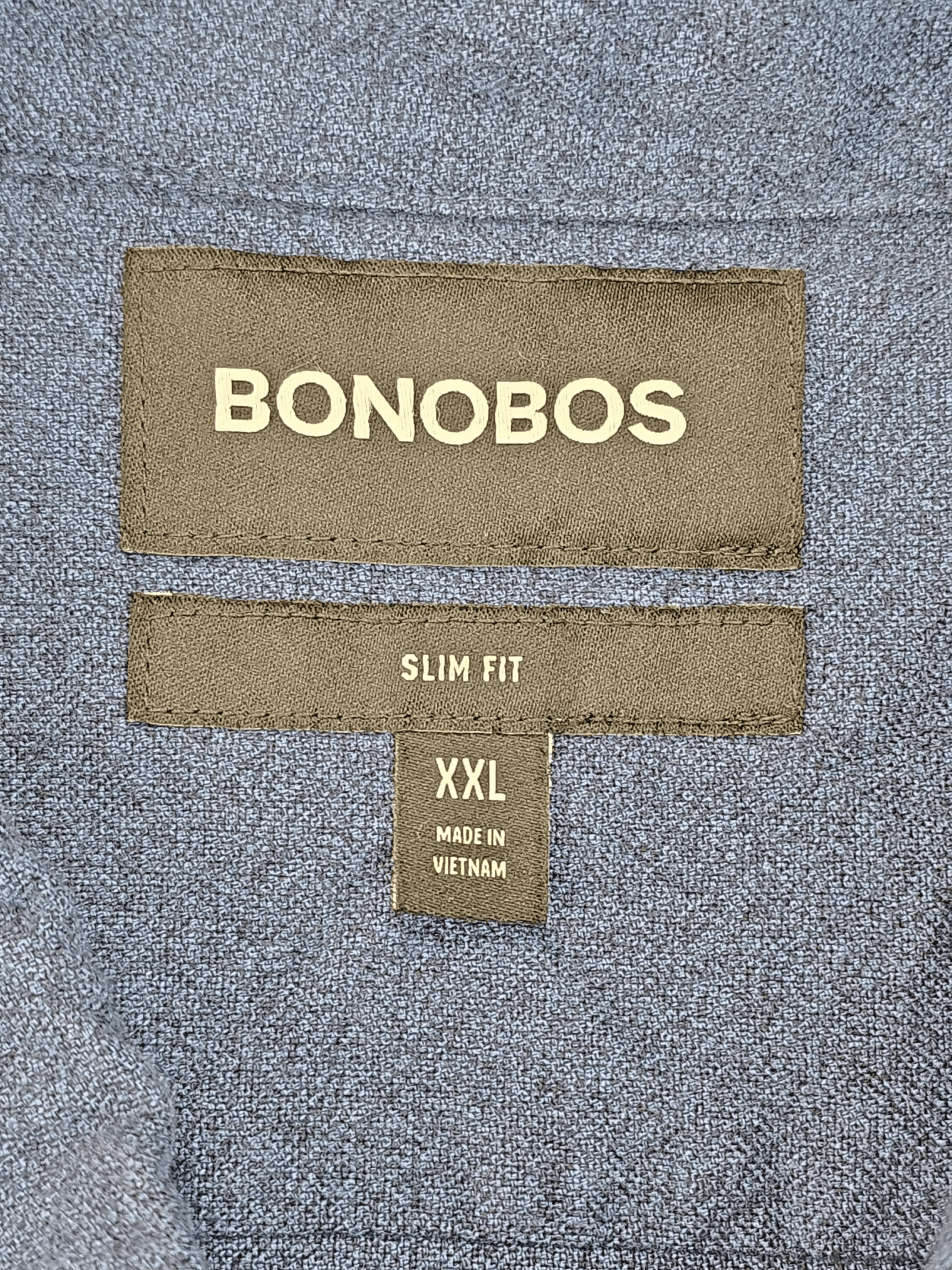 Clothing labels for Bonobos slim fit XXL size garment.