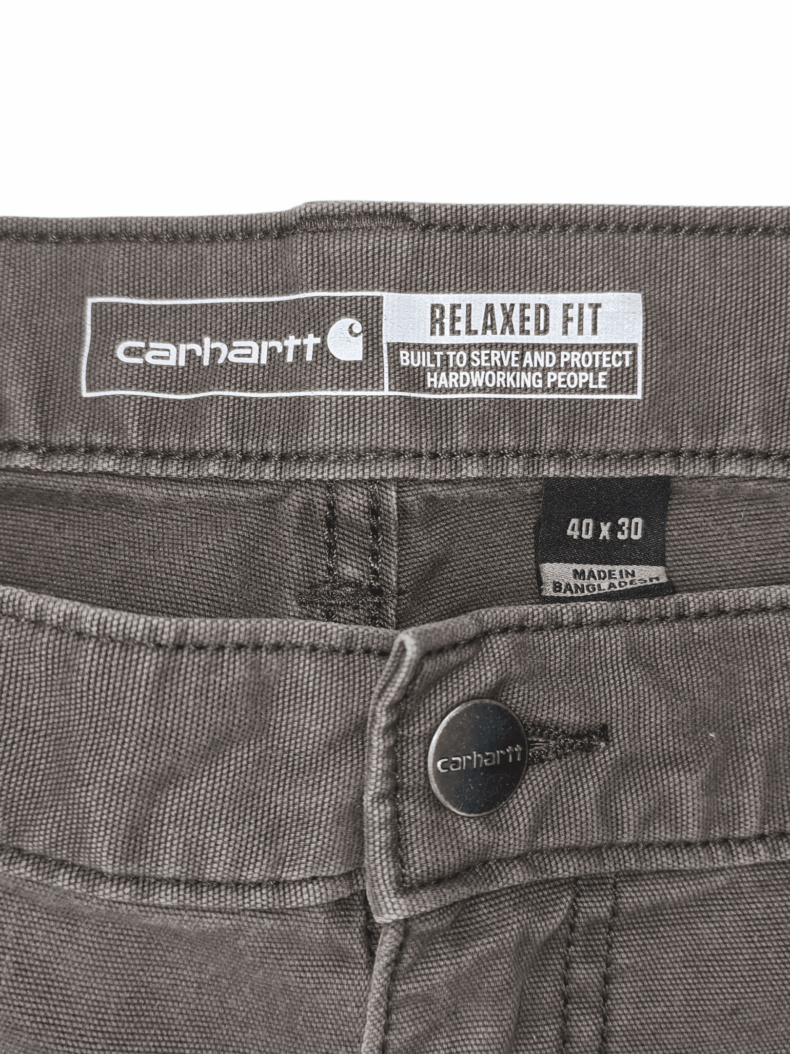 Close-up of Carhartt pants label showing relaxed fit and size 40x30.