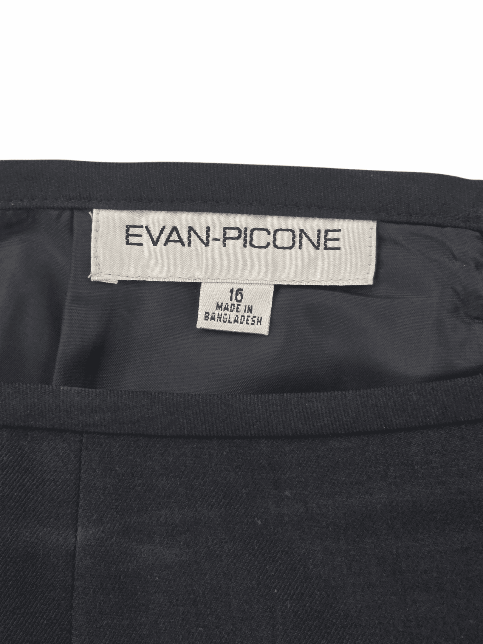 Close-up of Evan-Picone brand and size 16 tag on black blazer and skirt set
