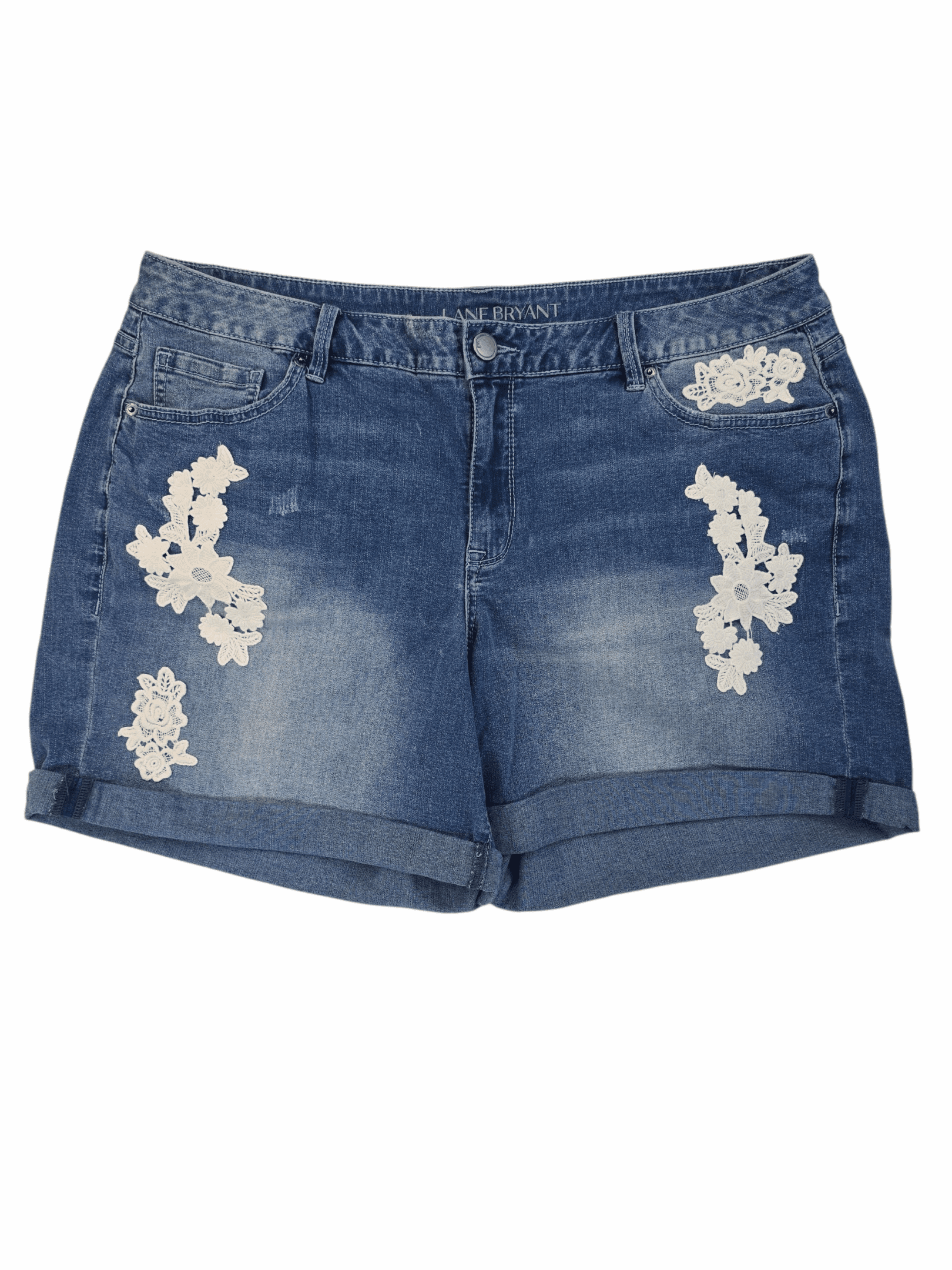 Blue denim shorts with floral lace patches and rolled hems.
