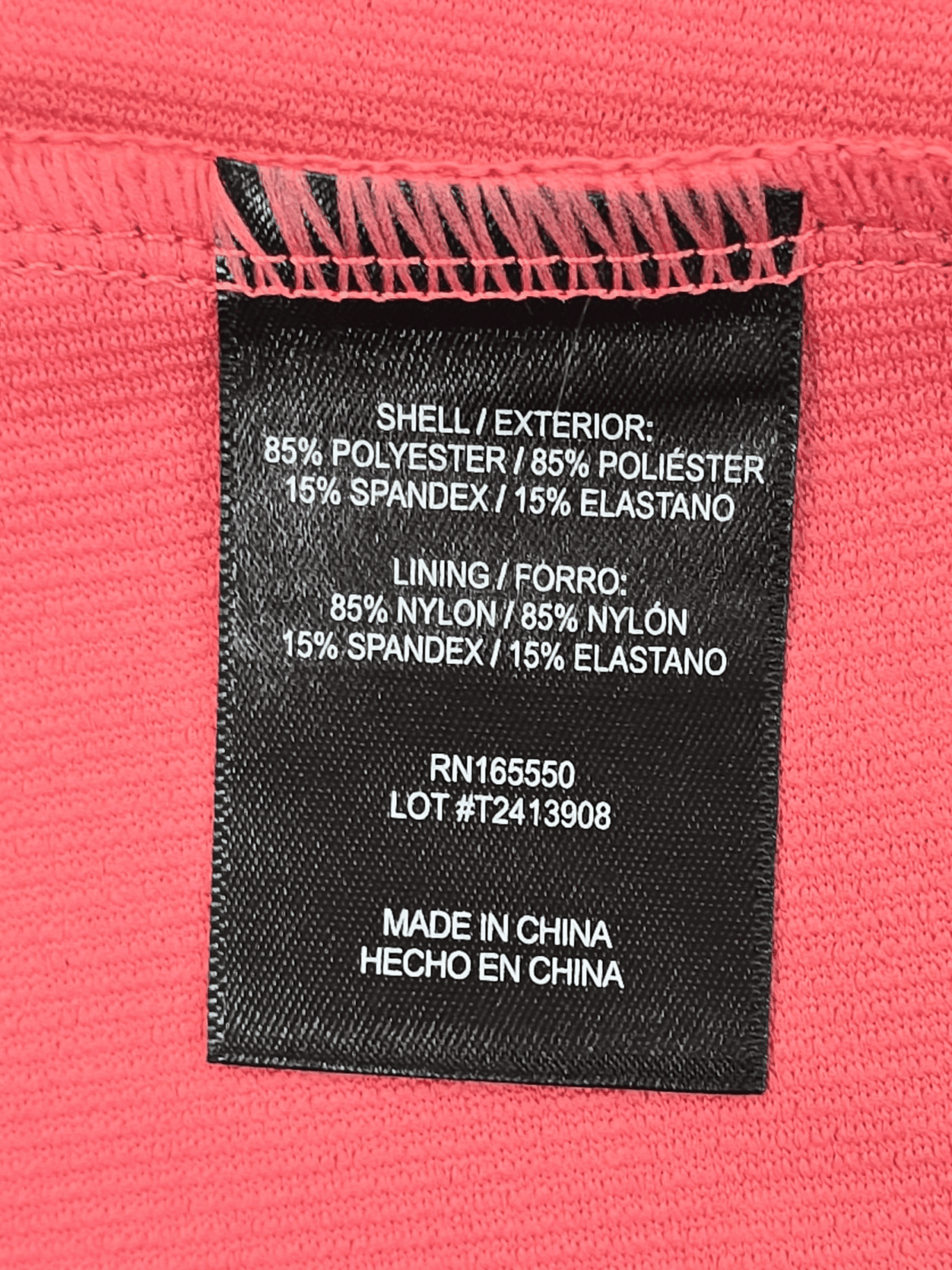Clothing label showing fabric composition and care details.