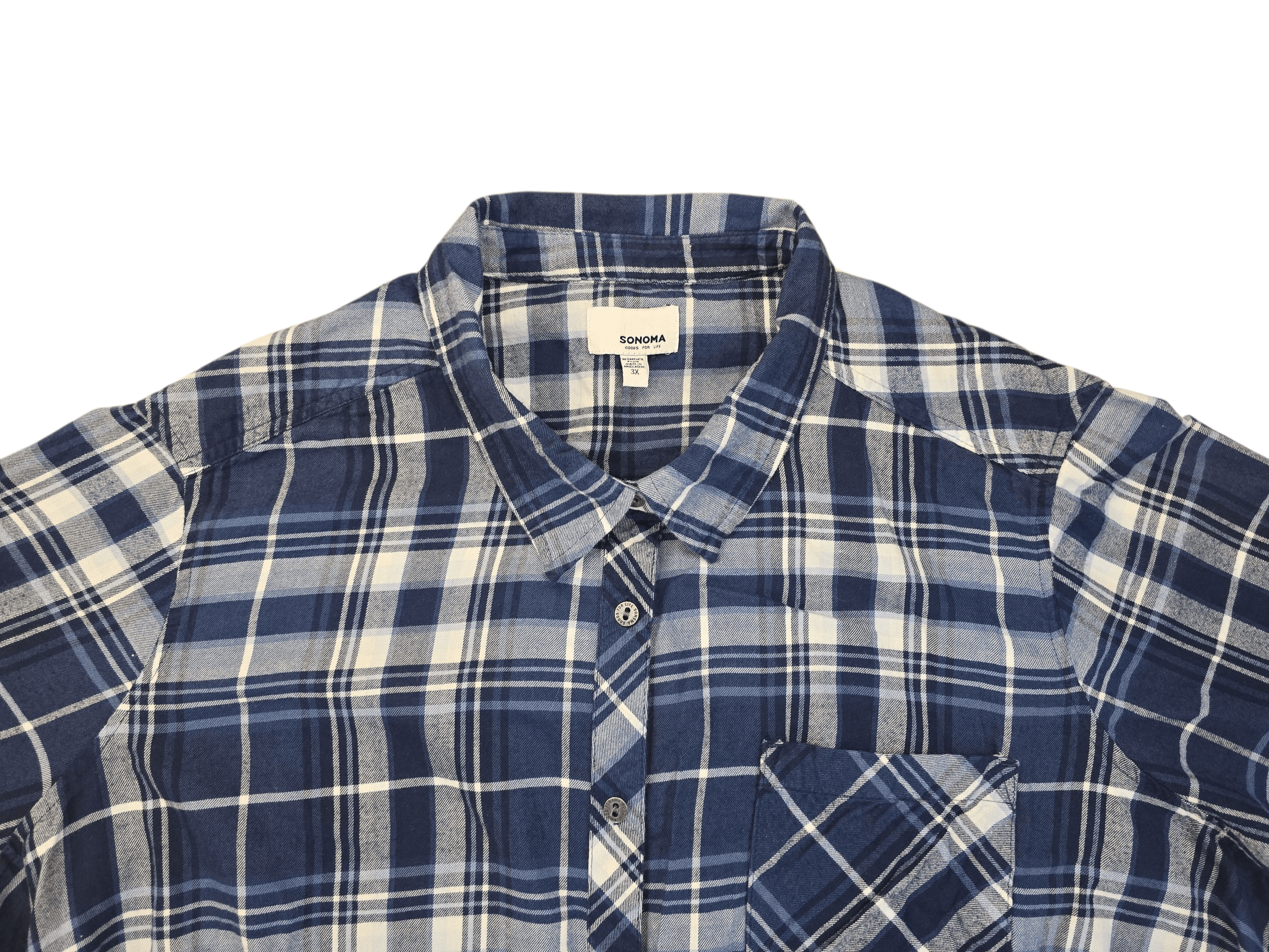 Close-up of Sonoma blue and white plaid brushed cotton button-up shirt showing collar, buttons, and fabric texture.