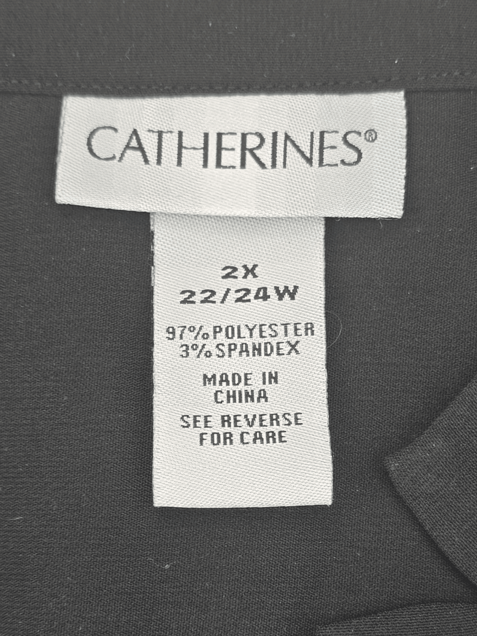 Clothing label from Catherines showing size and fabric details.