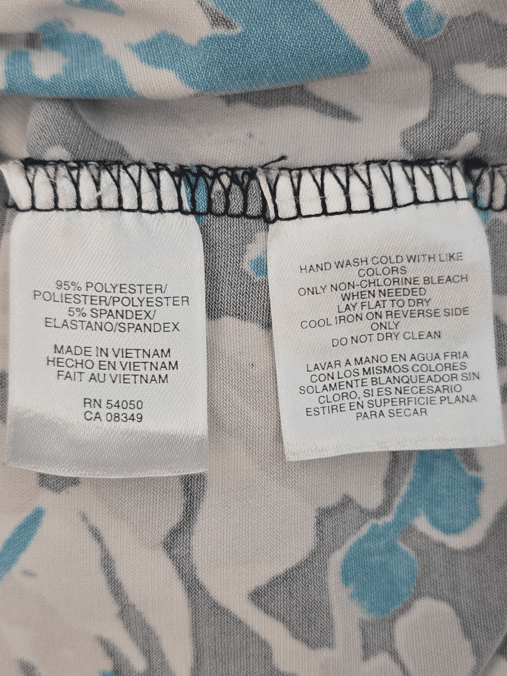 Fabric content tag from Jones Studio Separates leaf print pullover V-neck sleeveless top women’s plus size 24W