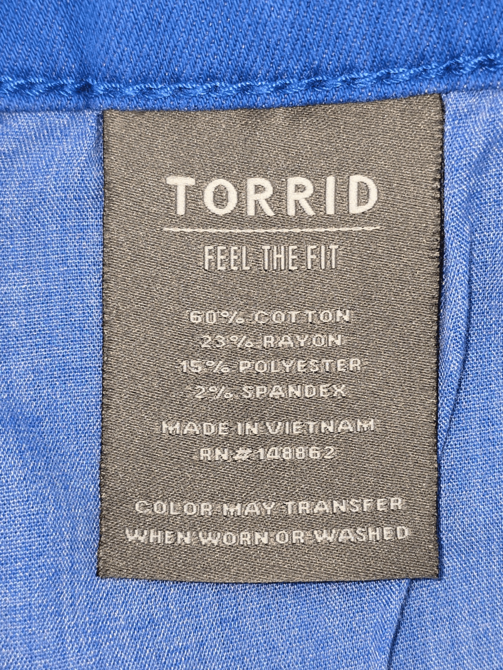 Clothing label from Torrid showing fabric composition and care instructions.