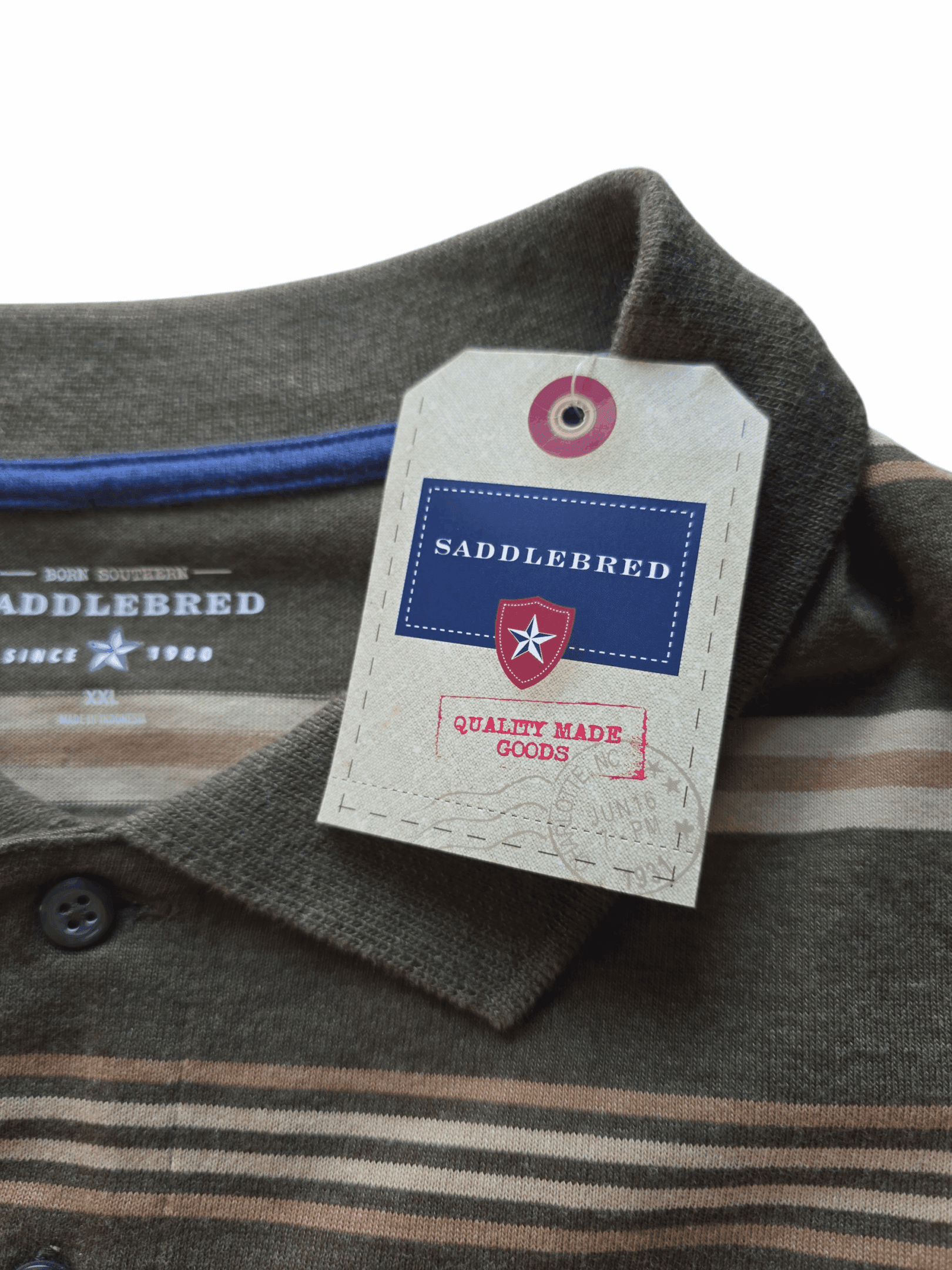 Close-up of a Saddlebred brand shirt collar with tags.
