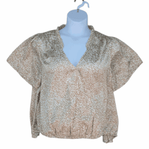 Front view of Belldini tan and white abstract print pleated neckline top in women’s size 2X showing pleated detail, short sleeves, and relaxed fit.