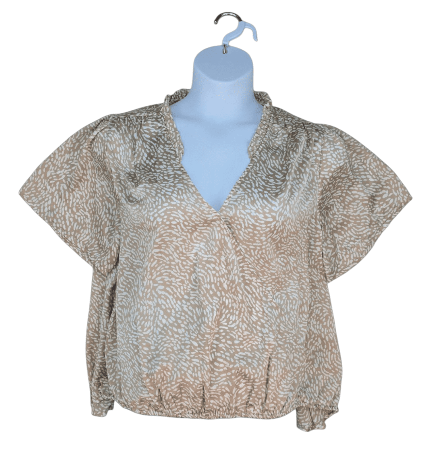 Front view of Belldini tan and white abstract print pleated neckline top in women’s size 2X showing pleated detail, short sleeves, and relaxed fit.