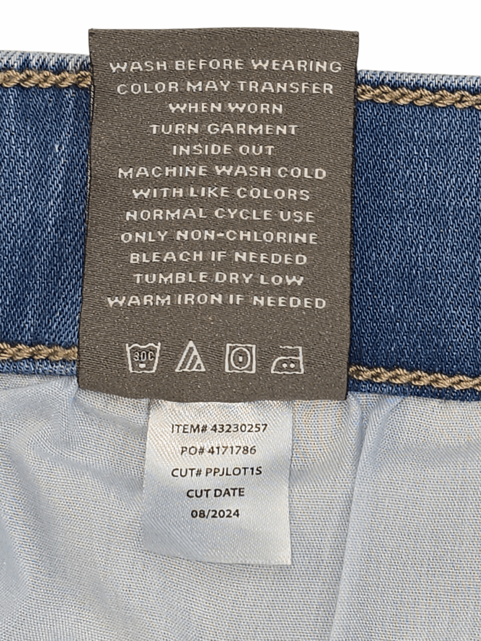 Garment care tag for Torrid light blue denim ankle pants showing washing and drying directions.