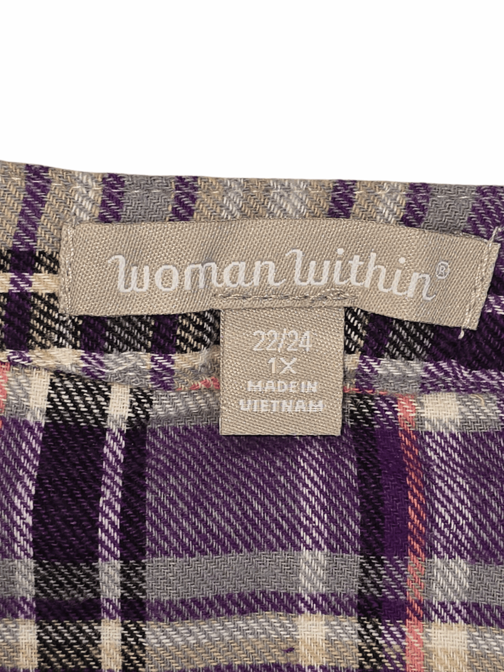 Woman Within brand and size tag on purple and pink plaid flannel button-up shirt in women’s plus size 1X.