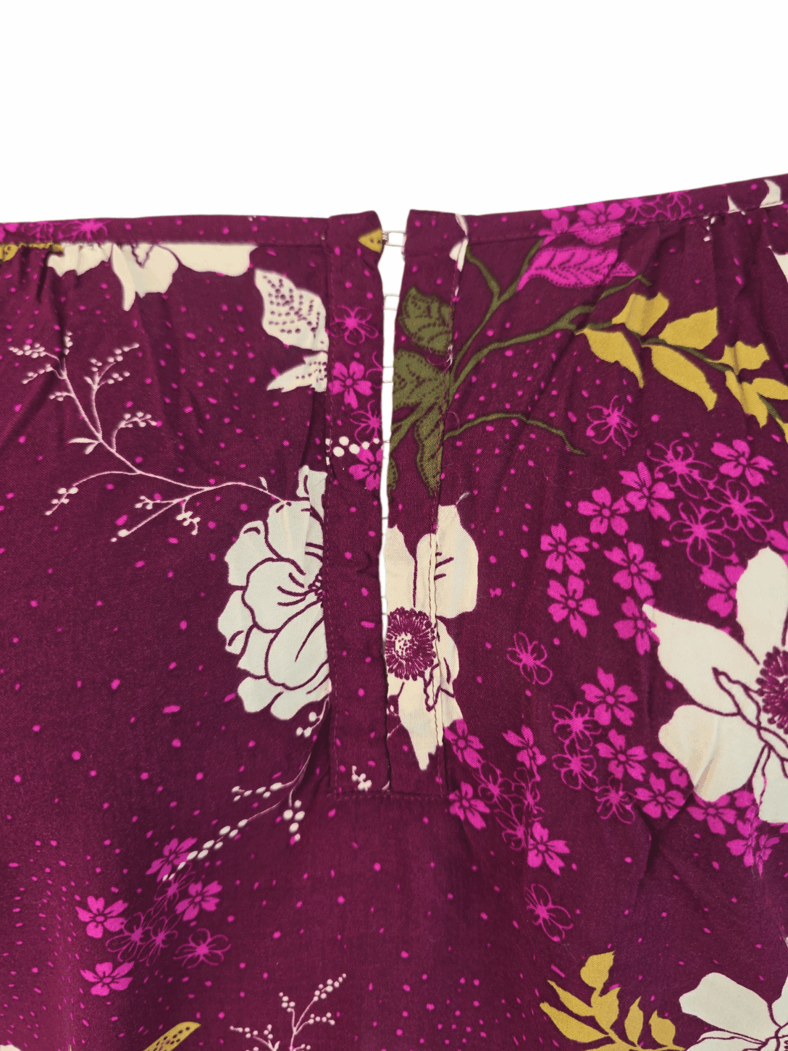 Close-up of a purple floral fabric with a zipper.