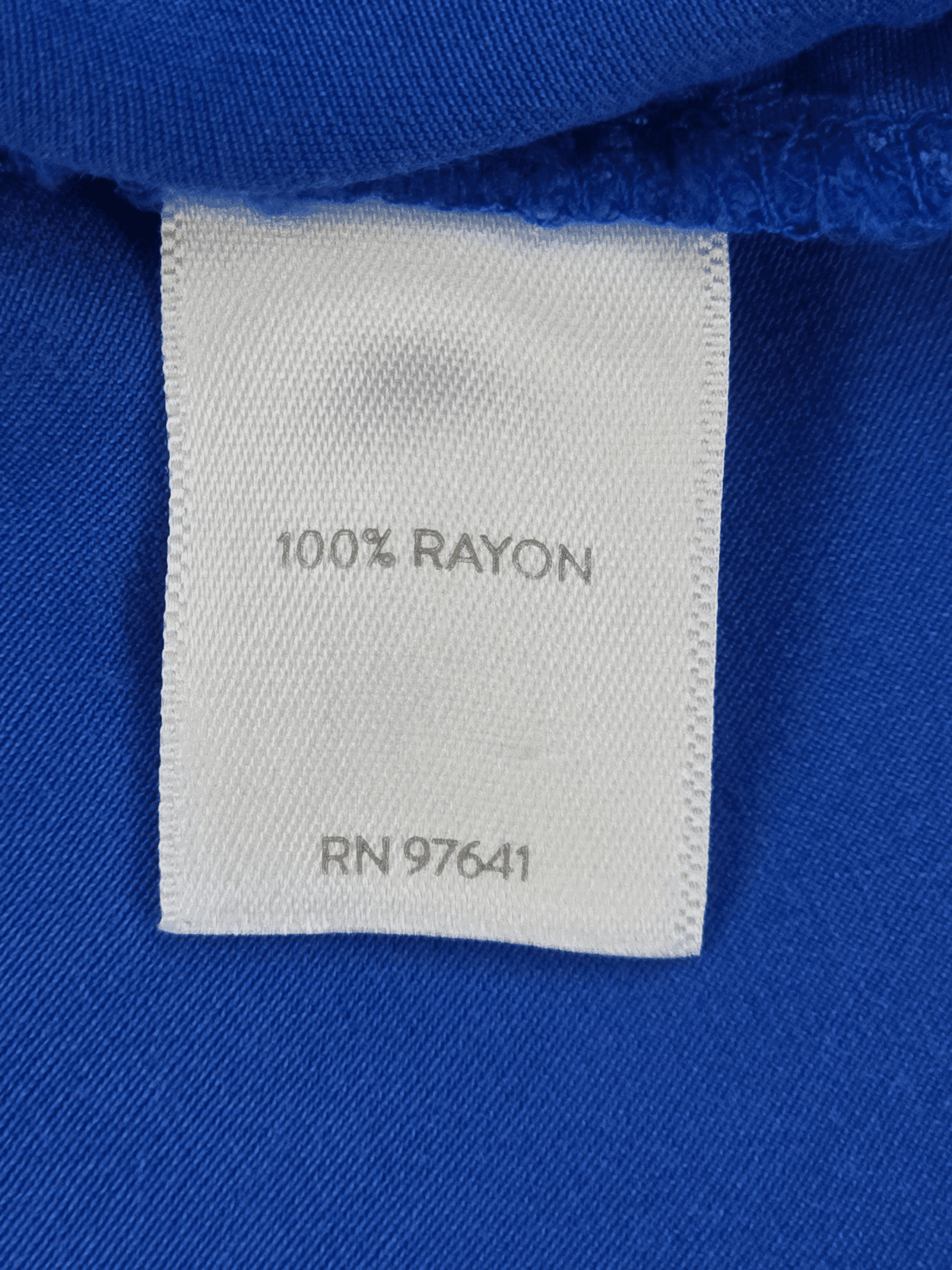 Clothing label showing fabric content and RN number.