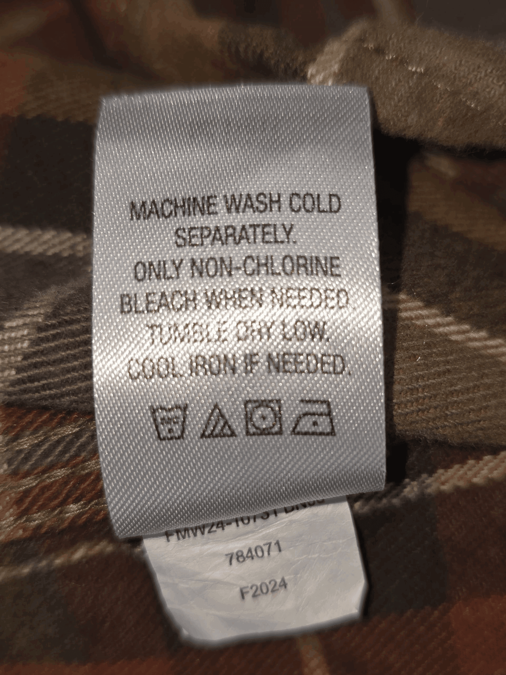 Garment care instruction tag from Ridgecut Toughwear green plaid cotton flannel shirt men’s size XL