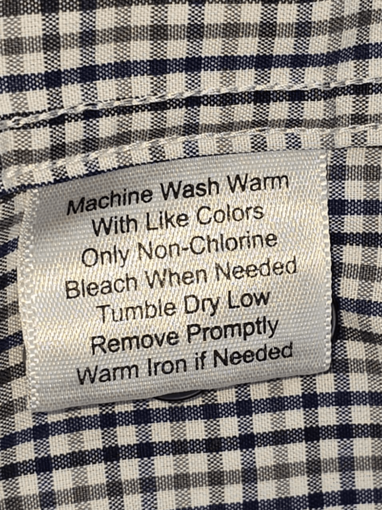 Joseph Abboud blue and white patterned button-up shirt care instructions label