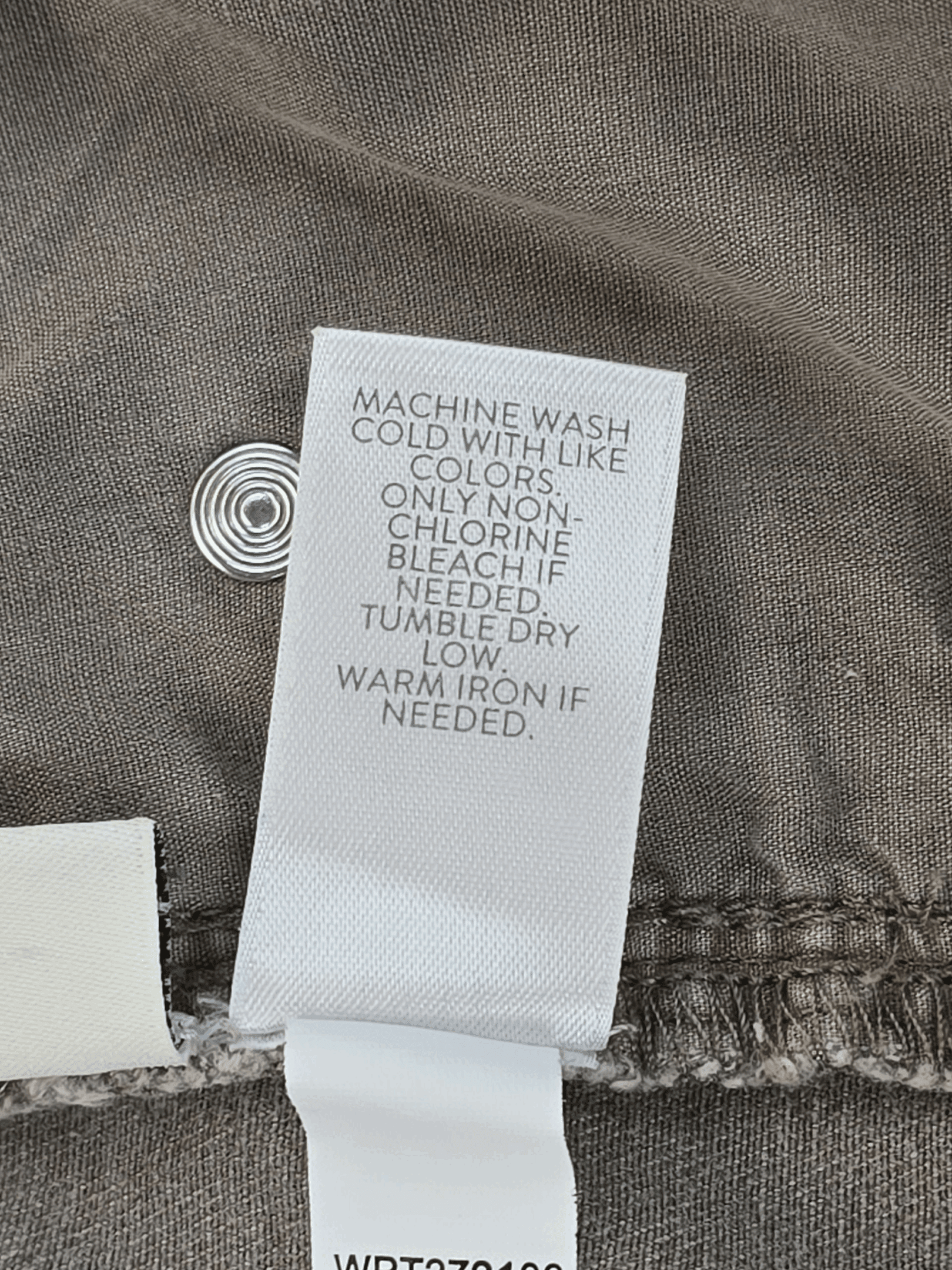 Garment care instruction tag from J. Jill Authentic Fit slim ankle green denim jeans size 18T