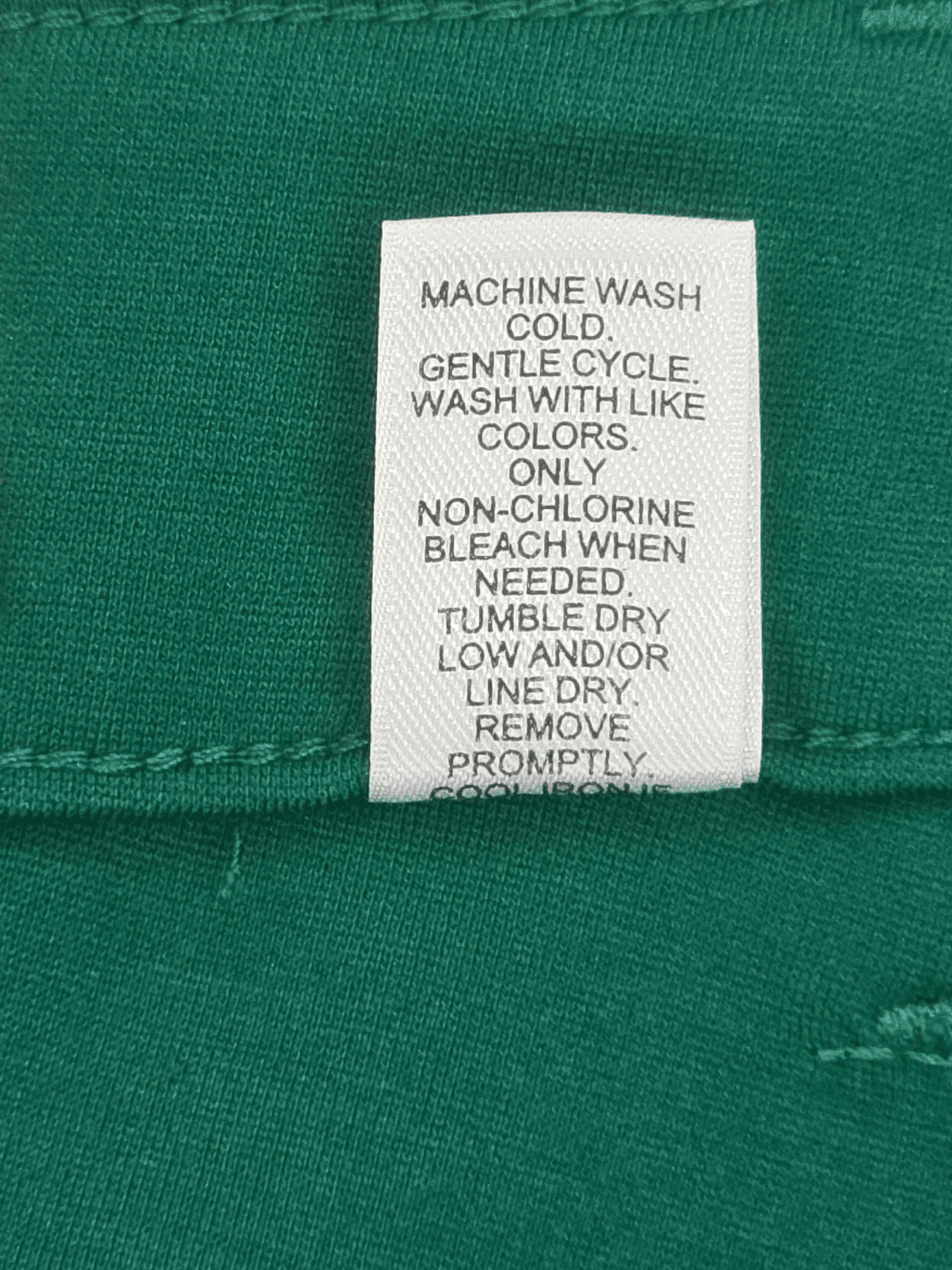 Cato deep green mid-rise skinny pants care instructions label