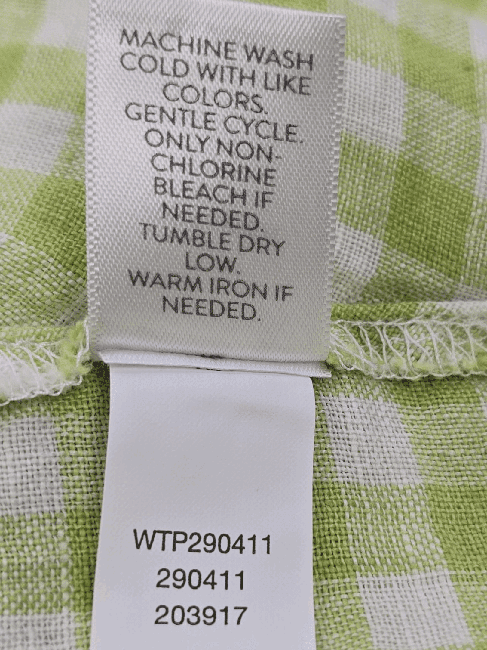 Garment care instruction tag from J. Jill green and white checked pullover top women’s plus size 2X
