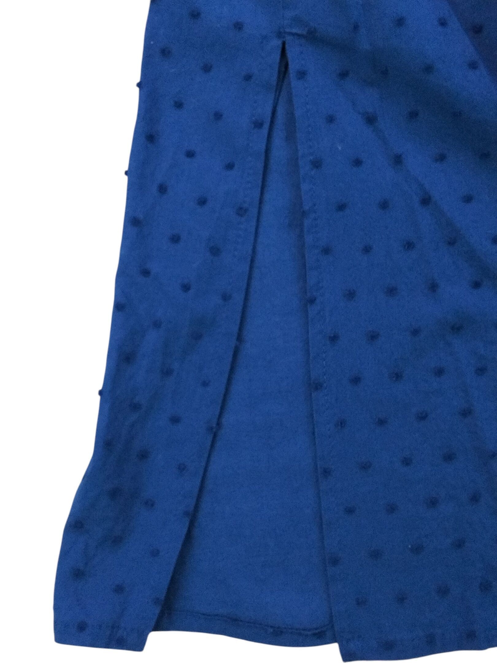 Close-up of blue fabric with a subtle dotted pattern.