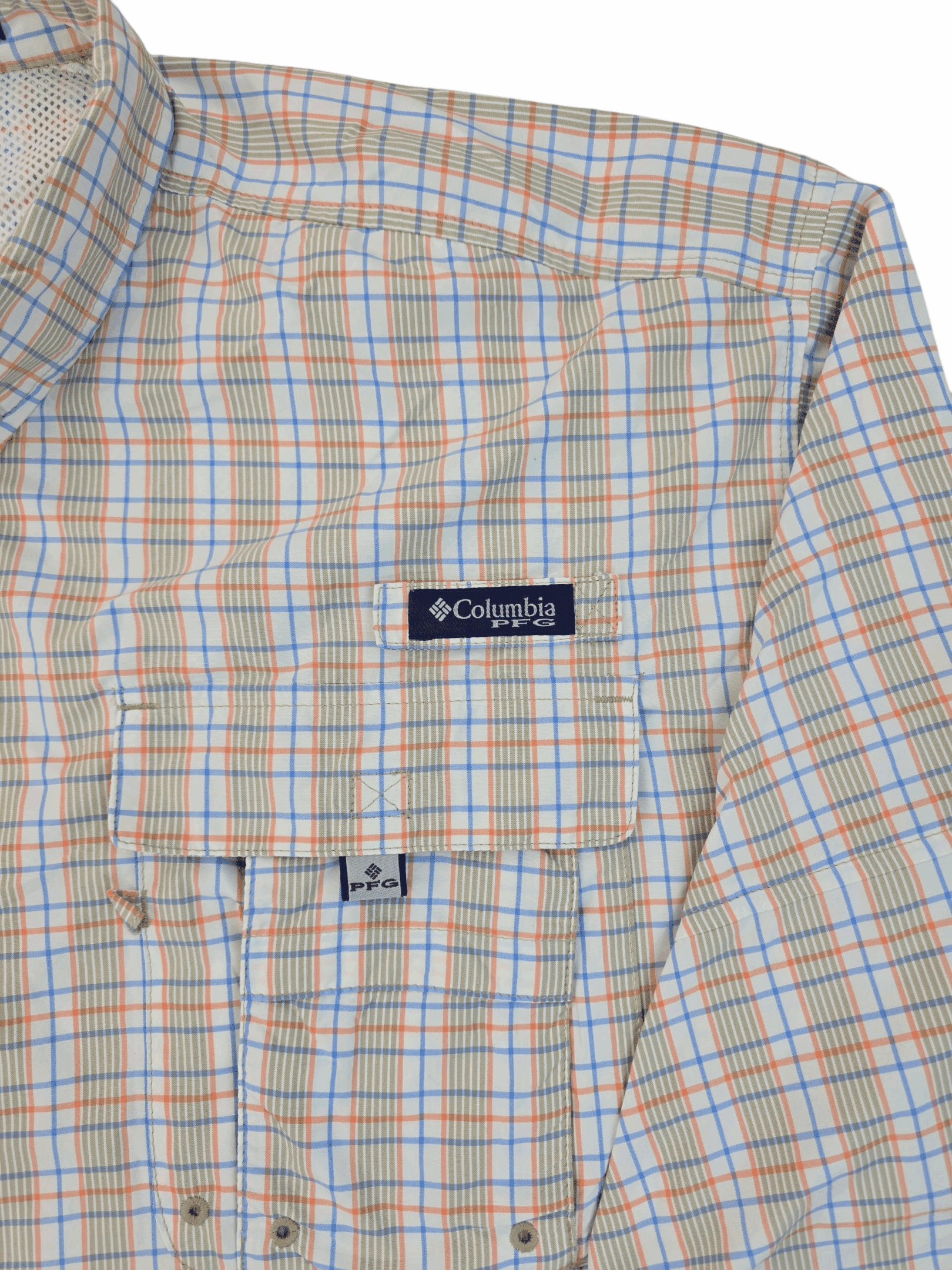 Close-up of a plaid Columbia jacket with logo patch.
