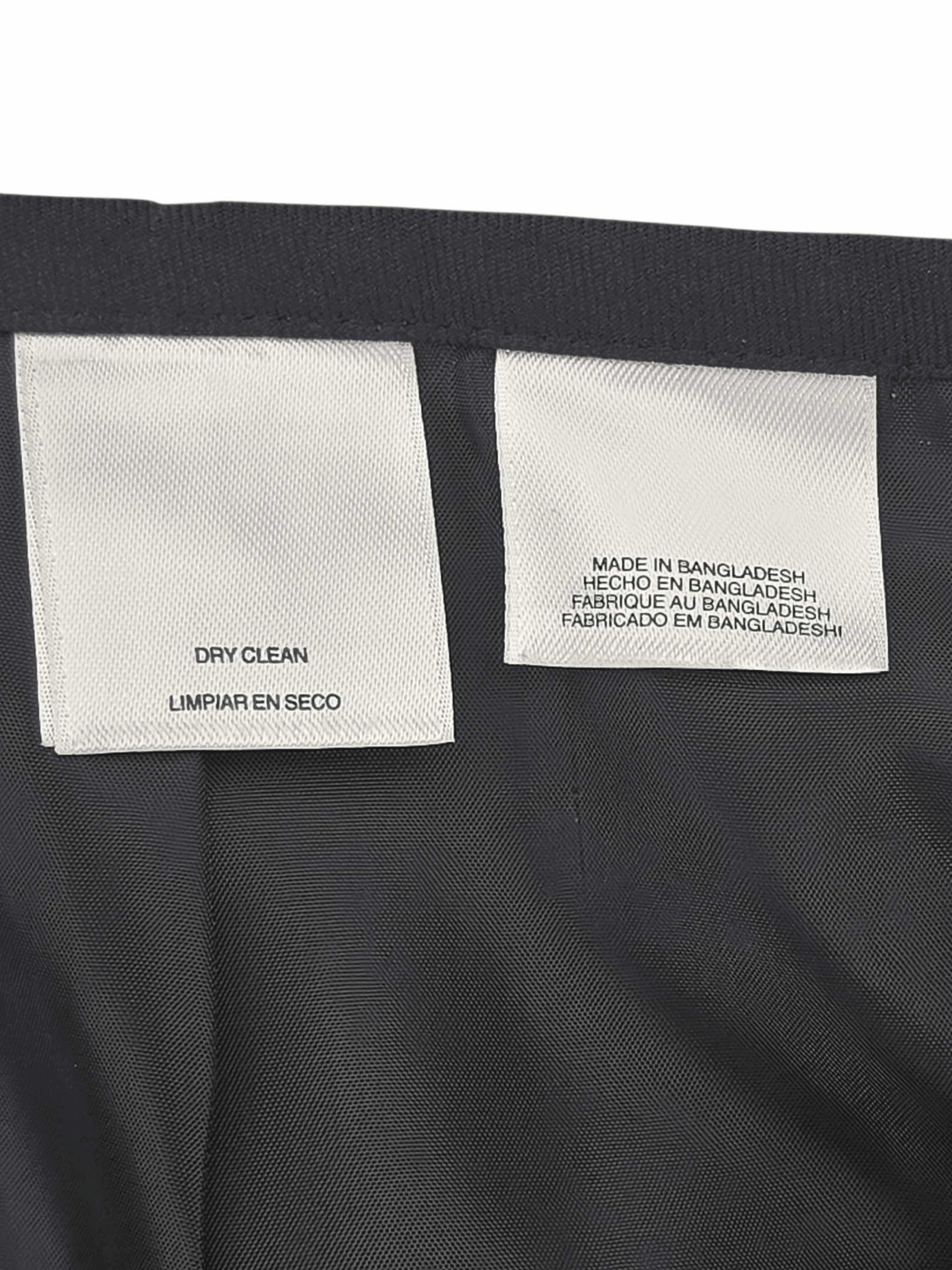 Close-up of material content and garment care tag on Evan-Picone women’s size 16 blazer and skirt set