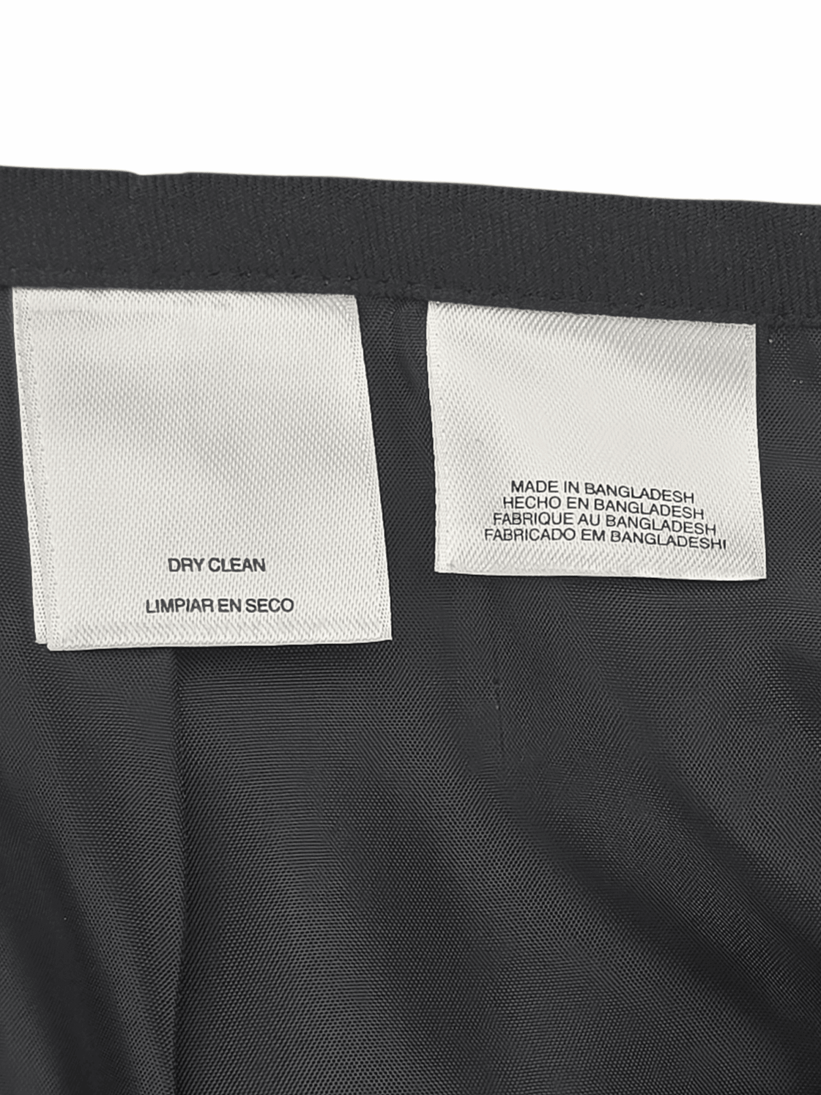 Close-up of material content and garment care tag on Evan-Picone women’s size 16 blazer and skirt set