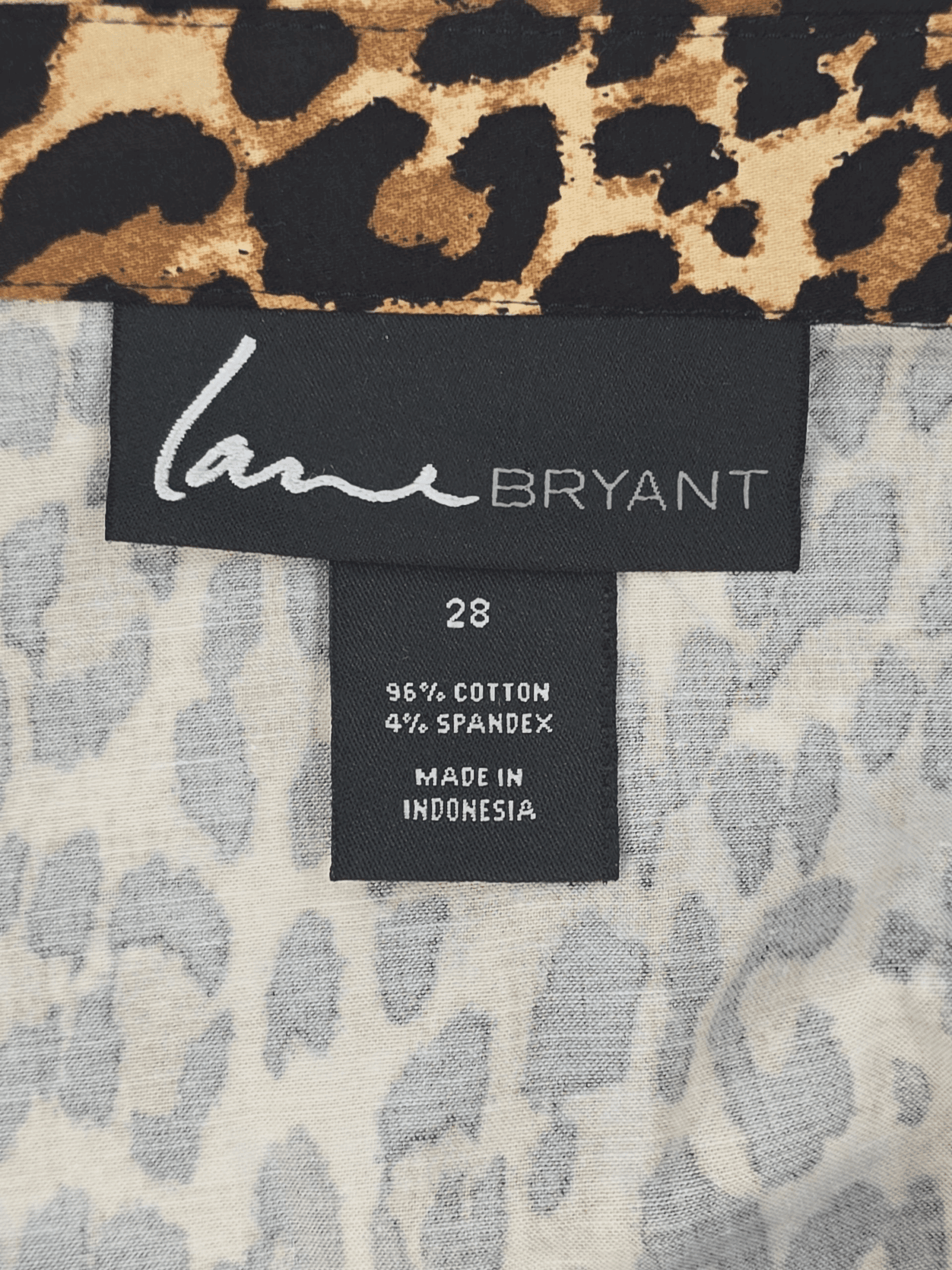 Fabric content tag from Lane Bryant animal print V-neck button-up top women’s plus size 28T