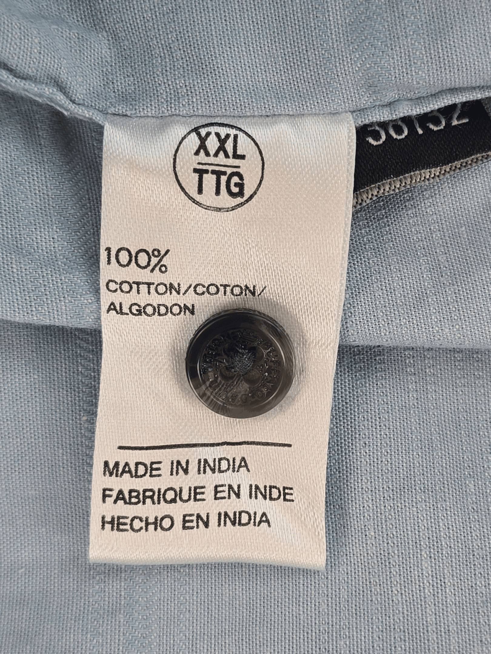 Clothing label showing 100% cotton, size XXL, made in India.