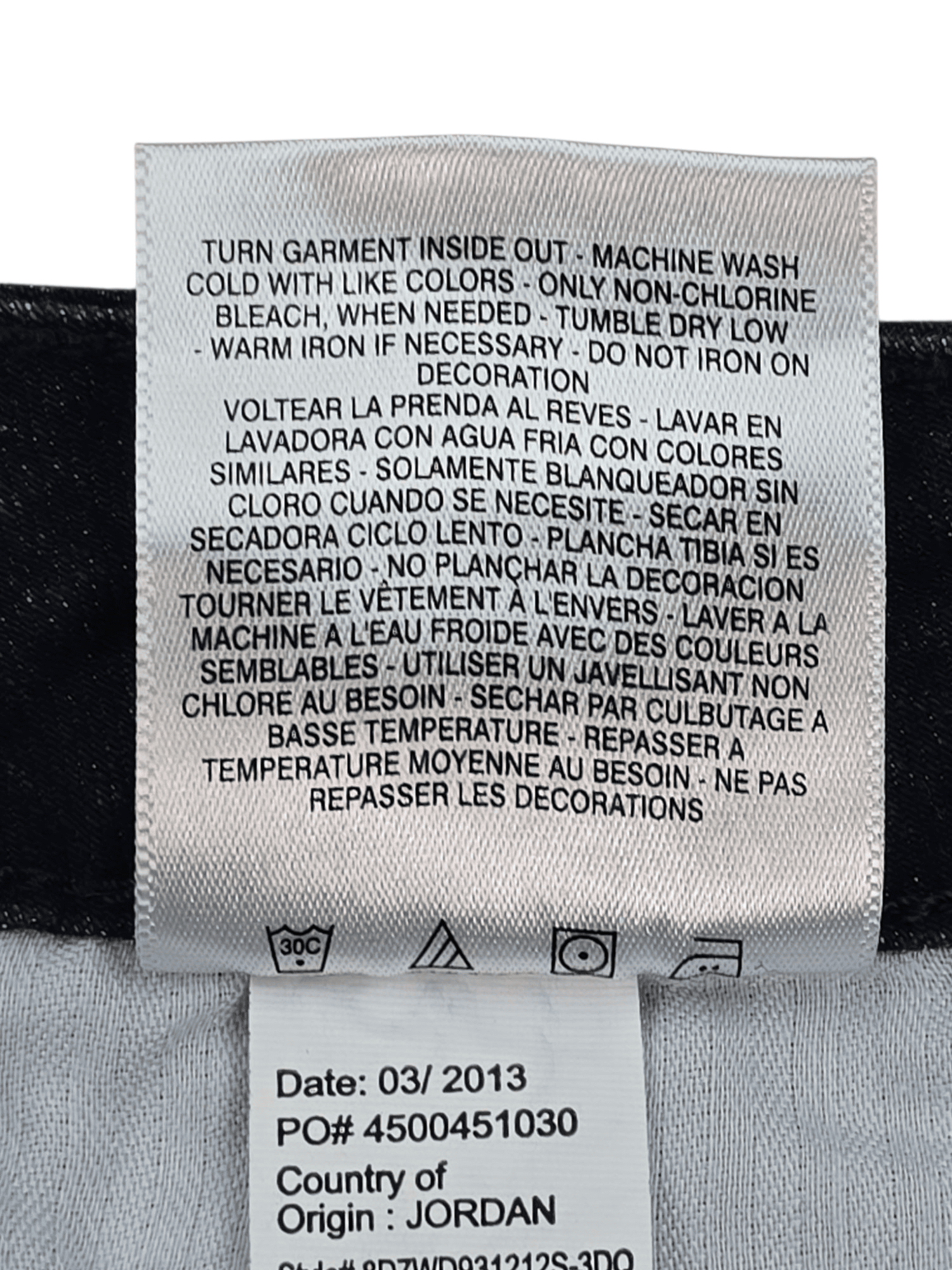 Garment care tag for Jones New York Lexington Straight indigo jeans showing washing and drying directions.