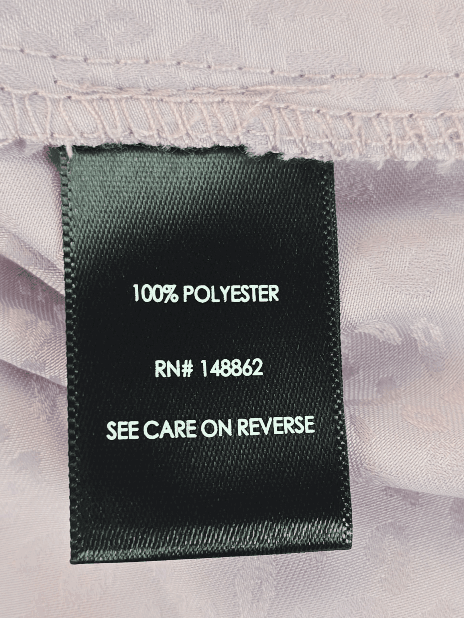 Fabric content tag from Torrid Sophie purple animal print adjustable spaghetti strap top women’s plus size 3X