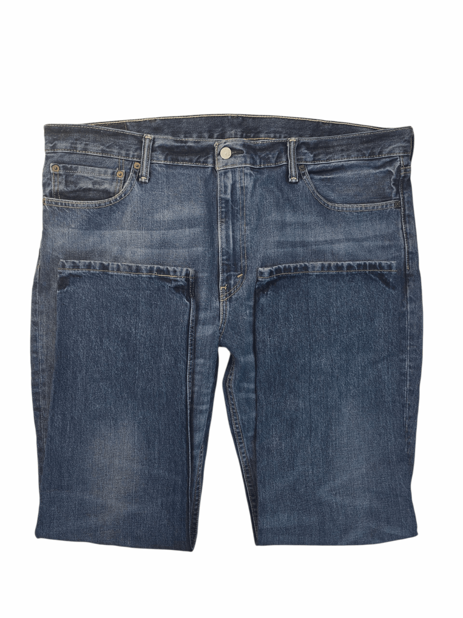 Close-up of Levi’s 511 men’s blue straight leg jeans showing button, zipper, and denim texture.