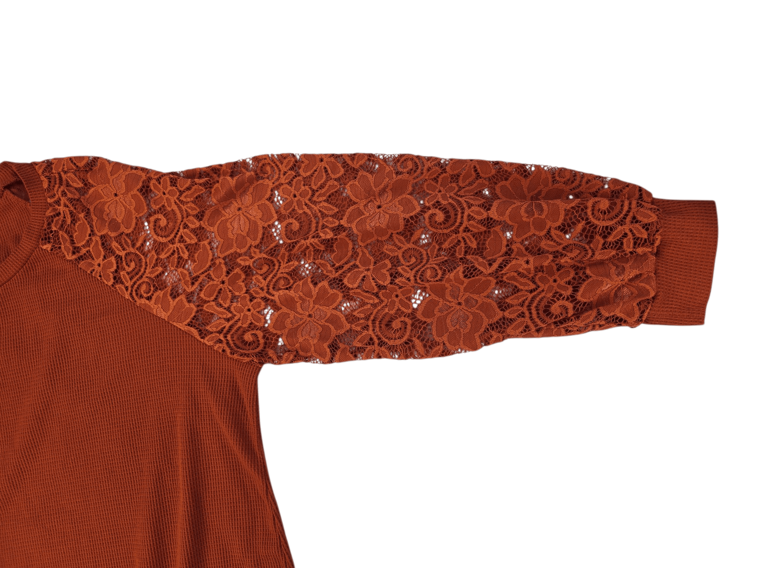 Close-up of a rust-colored garment with a lace sleeve detail.