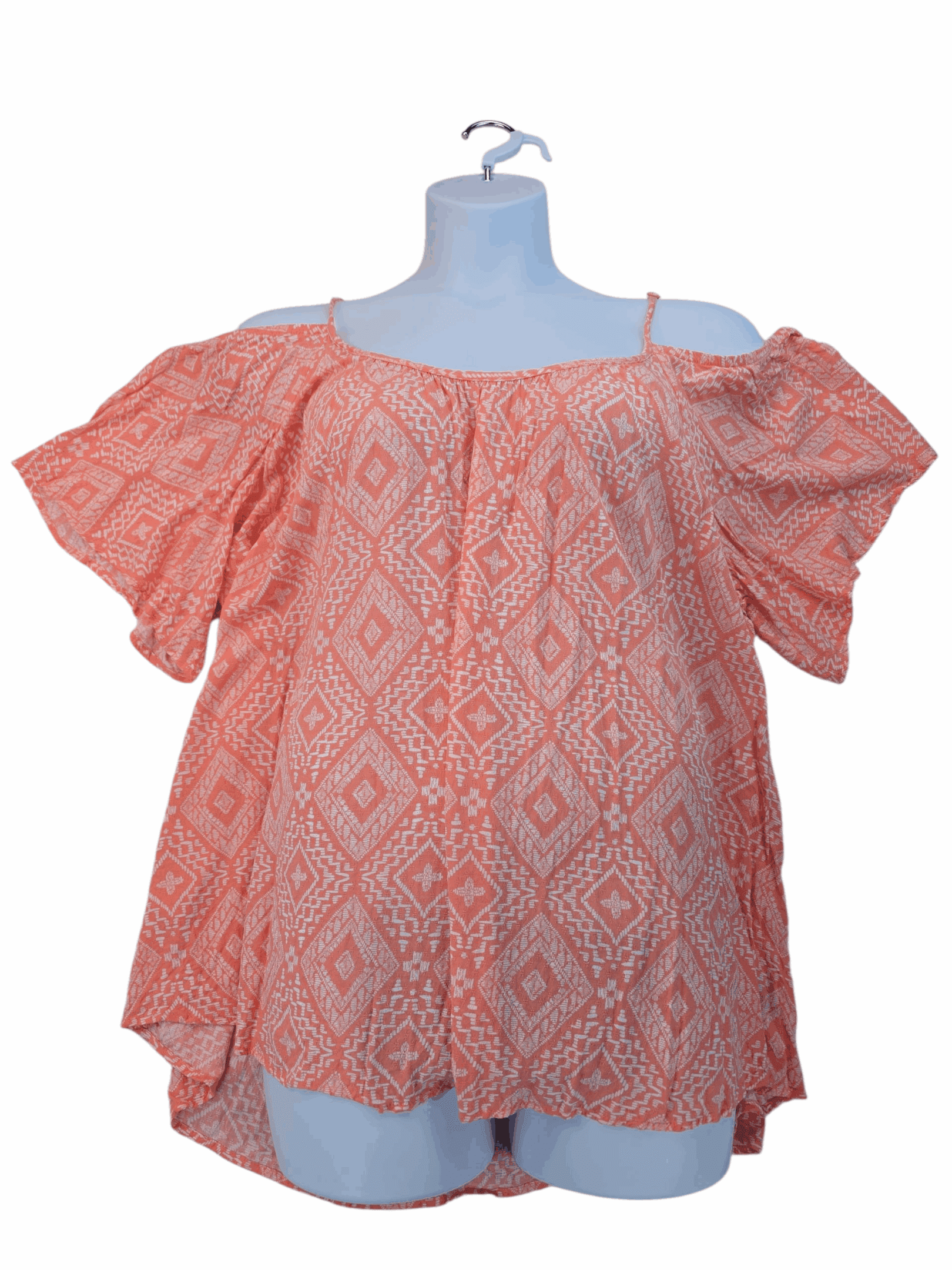 Coral off-shoulder blouse with puff sleeves and geometric pattern.