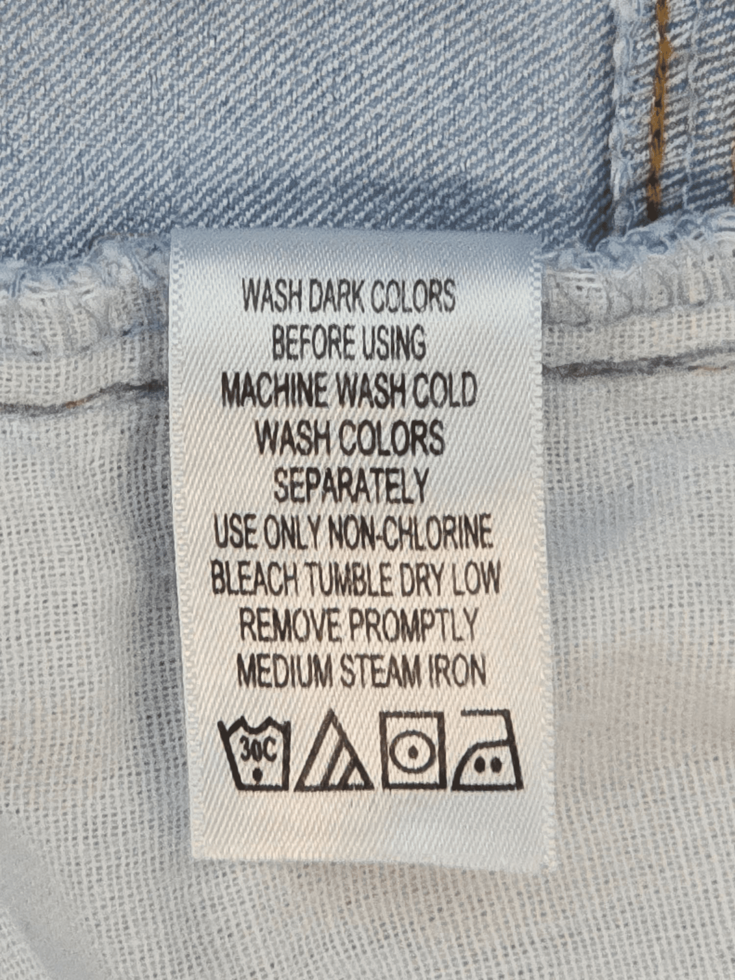 Woman Within light blue denim cuffed shorts care instructions tag