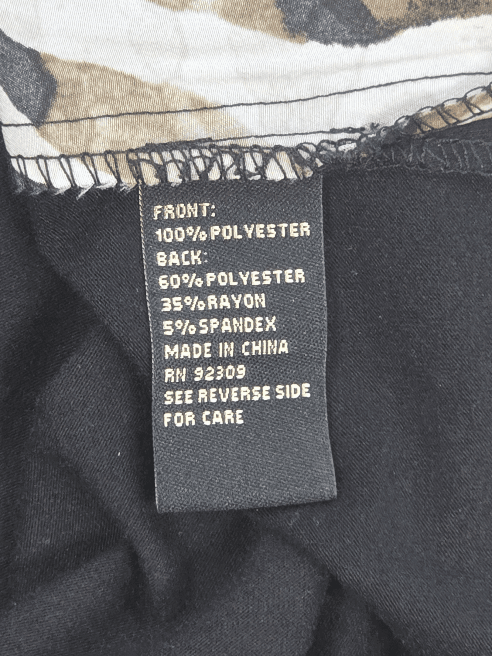 Fabric content tag from DG2 animal print layered look tank top women’s plus size 2X