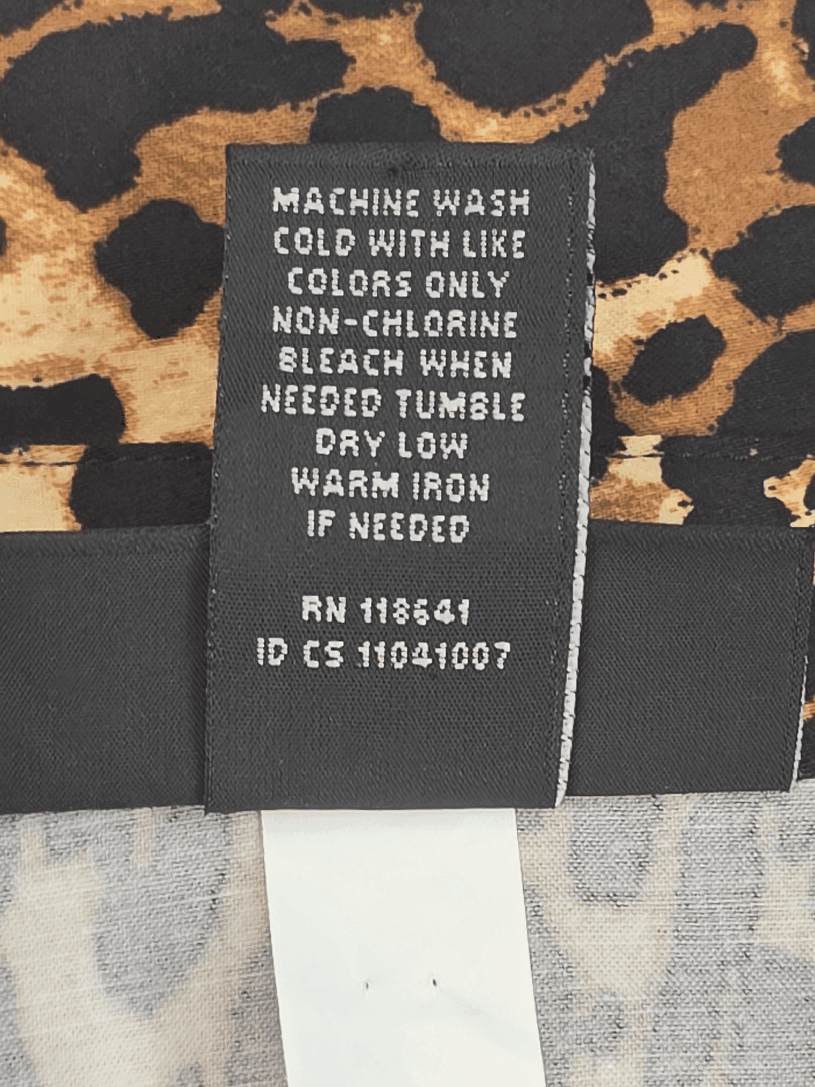 Garment care instruction tag from Lane Bryant animal print V-neck button-up top women’s plus size 28T