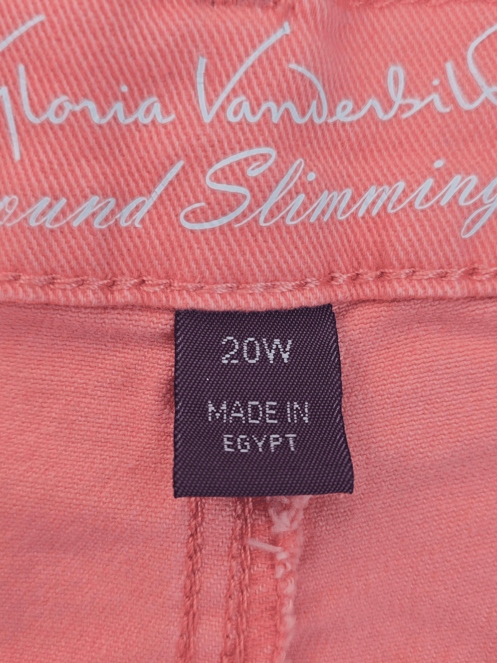 Gloria Vanderbilt brand and size tag on Amanda pink denim shorts in women’s plus size 20W.