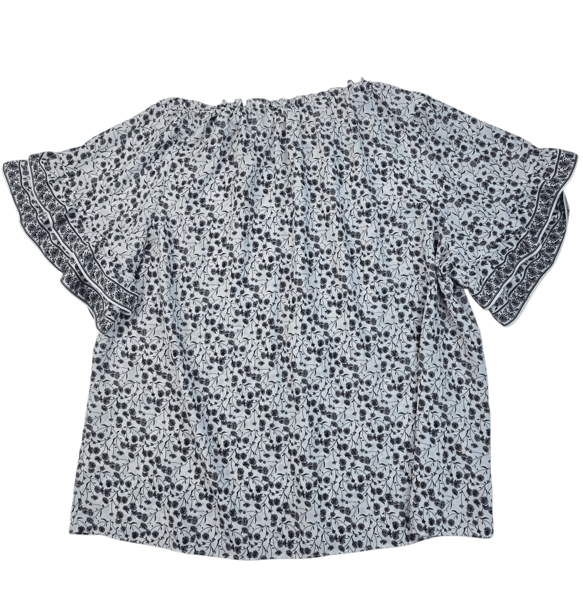 A short-sleeved, patterned blouse with a loose fit.