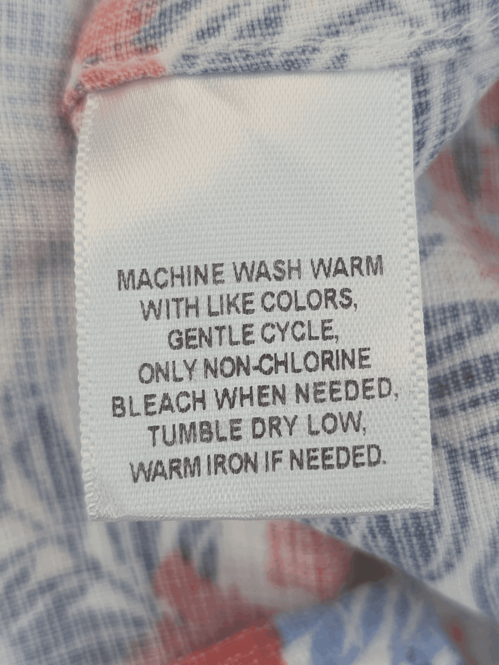 Clothing care label with washing instructions.