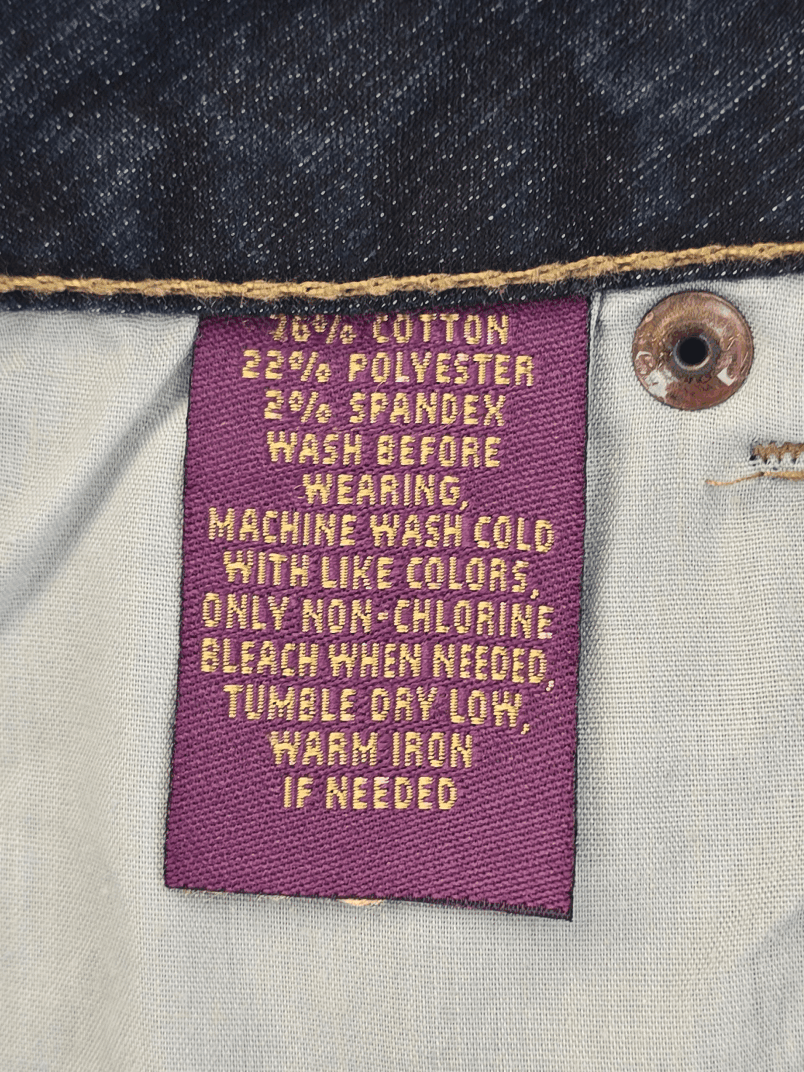 Material content tag listing cotton, polyester, and spandex blend for Avenue Jeans The Boot blue denim.