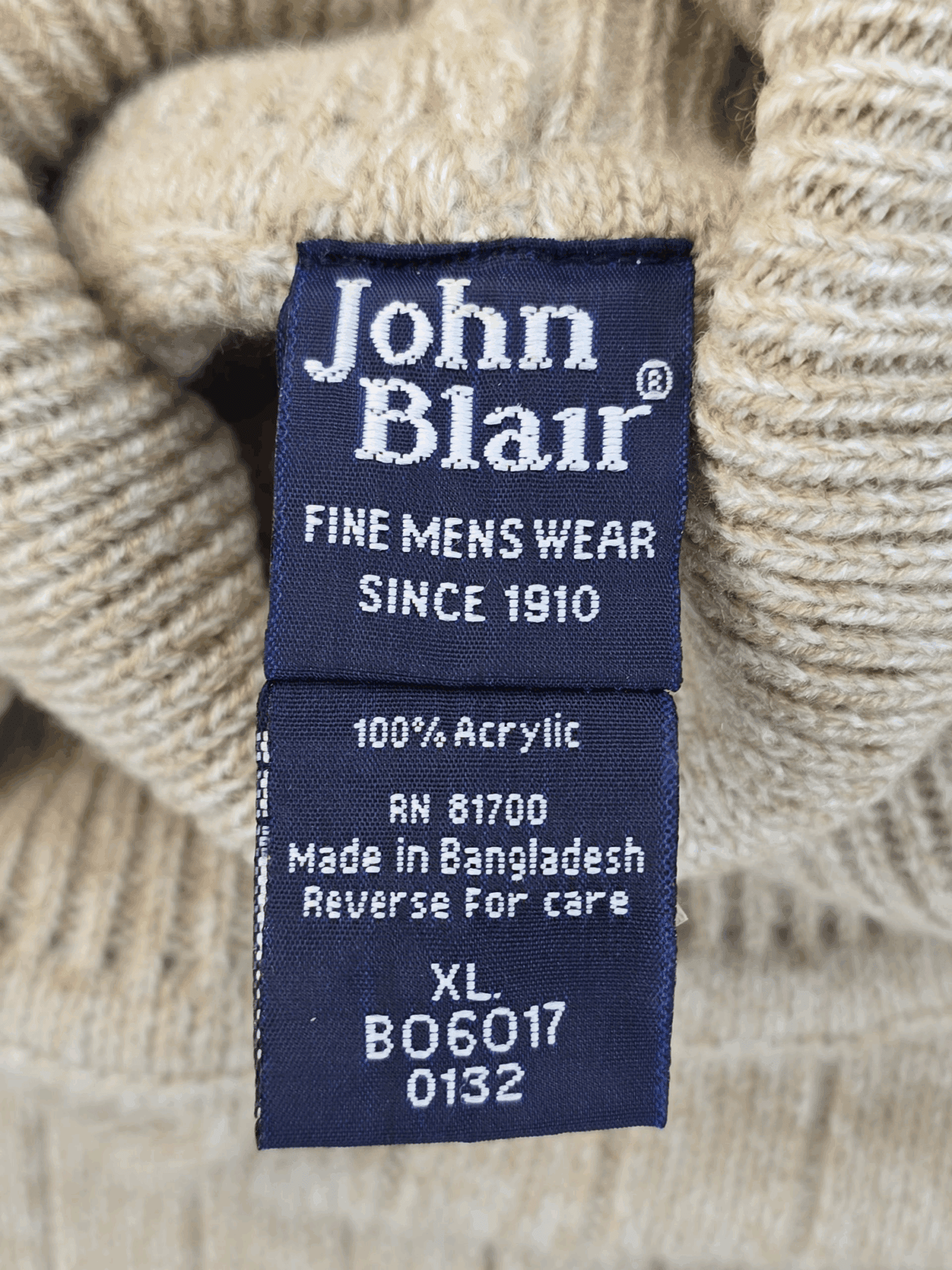 Clothing label showing John Blair brand and fabric details.